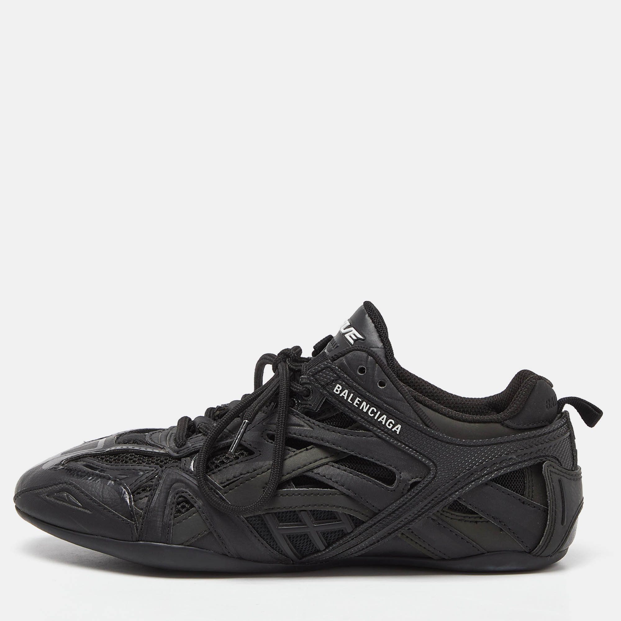 Add a fun vibe to your outfit with these bright eye catching Balenciaga Drive sneakers. Available in a classy black shade these sneakers will add liveliness to your look. Pair them with jeans knitted tight dresses skirts for a chic look.