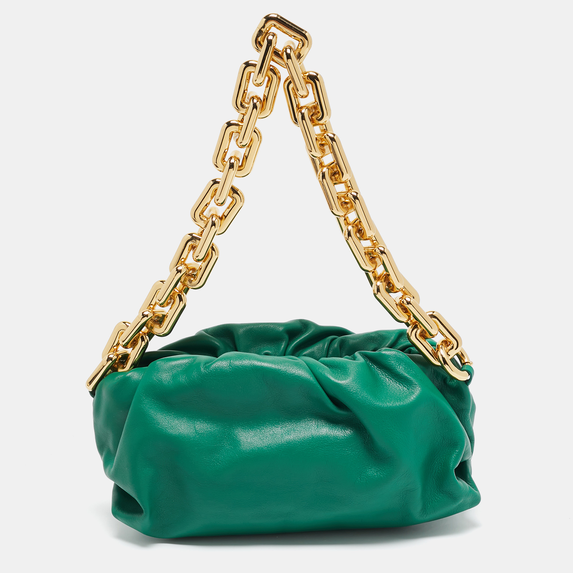 Bottega Venetas Daniel Lee added a chunky chain strap to the already iconic Pouch bag. Made in Italy from supple leather in a versatile green hue its gathered and fastens with a magnetic closure at the top. Carry it around and get admiring glances.