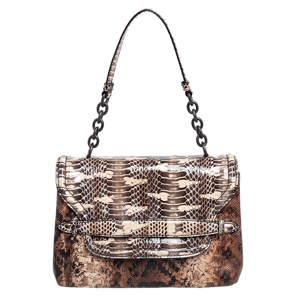 Crafted from python leather in stunning shades of brown this bag from Bottega Veneta features a flap design. The bag has a shoulder chain with a leather rest and a well sized suede interior to hold your essentials.