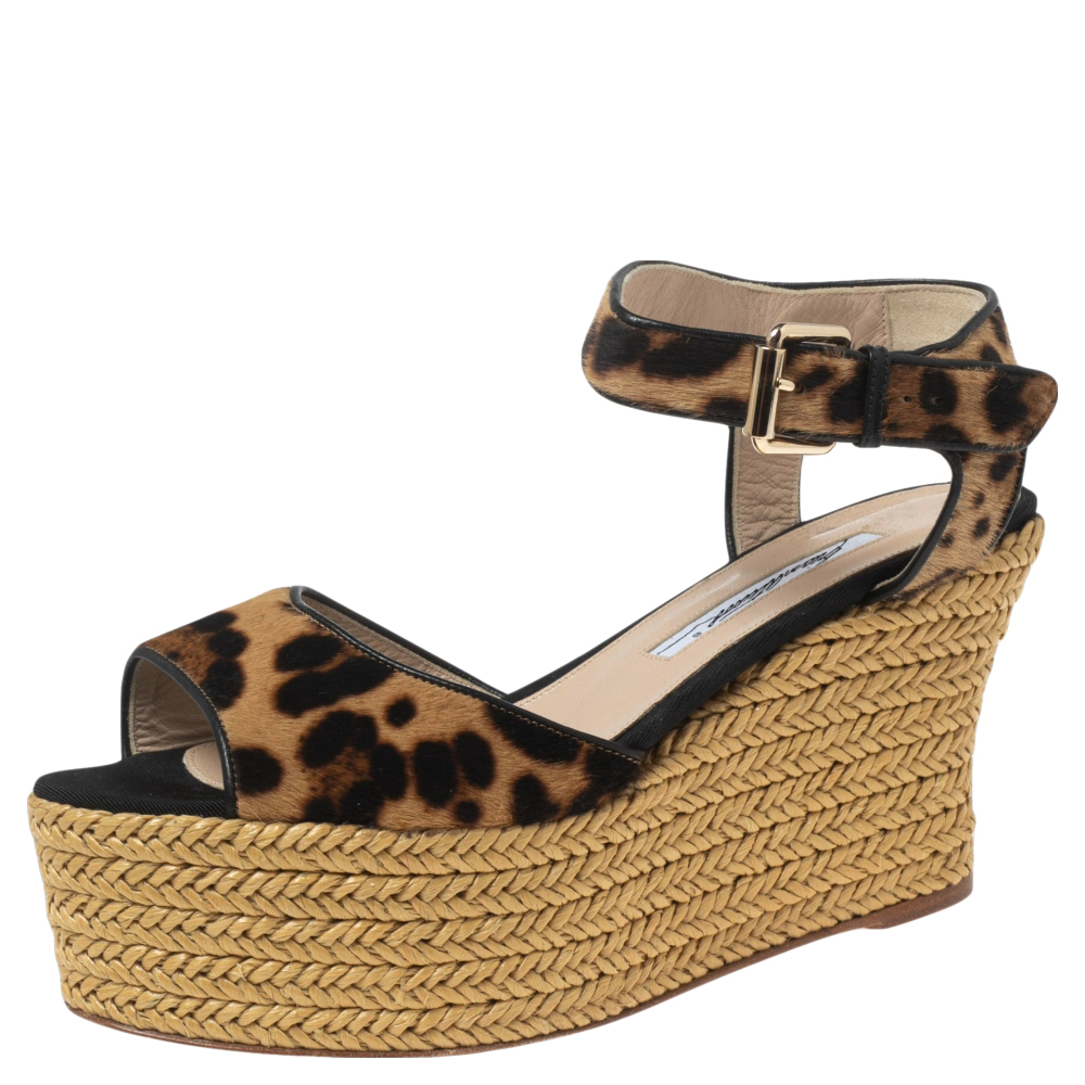 These sandals from the House of Brian Atwood are absolutely gorgeous They are fashioned in beige black pony hair on the exterior and flaunt espadrille wedge heels an ankle strap and gold toned hardware. These sandals are great for casual use.