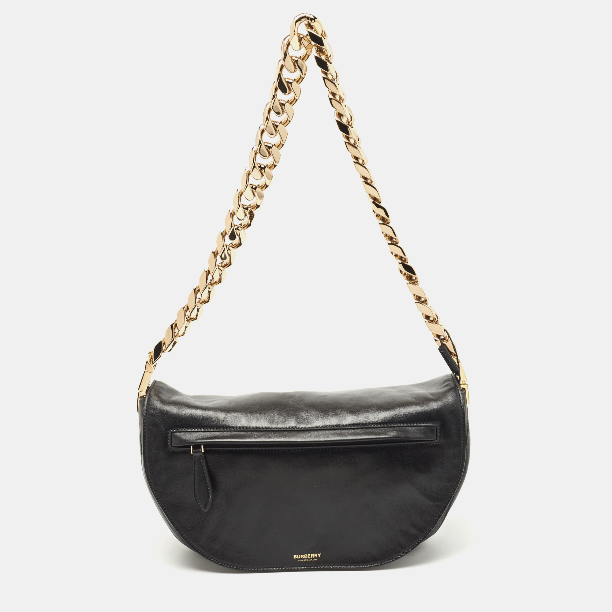 With an architectural shape this Burberry Olympia bag resembles the crescent moon. The brand signature on the front lends to its instant identification and it can be carried conveniently with a shoulder strap. Capturing the essence of feminity it celebrates beauty through its creative design. The top zipper closure of the bag secures its lined interior.