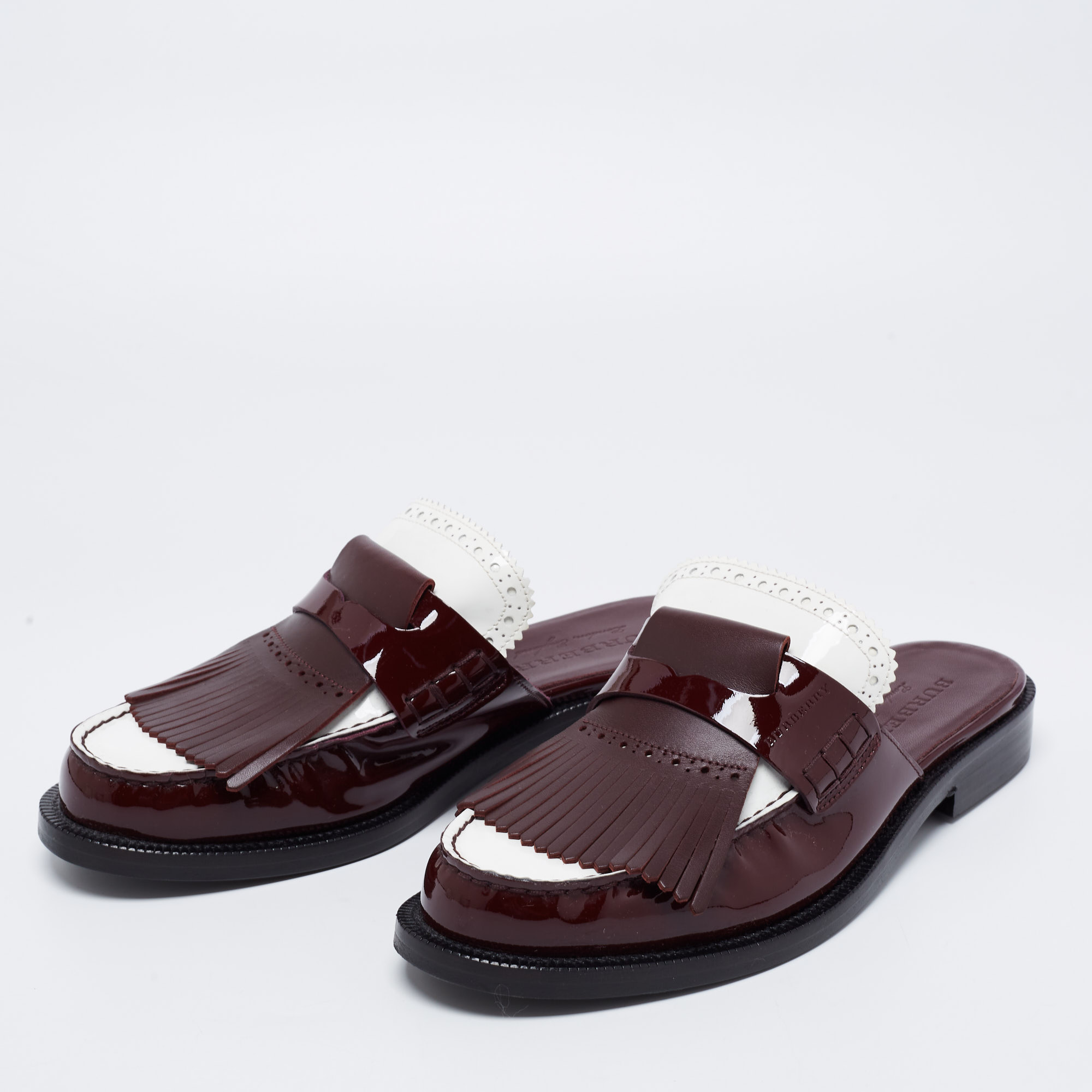 

Burberry Two Tone Patent Leather Beckshill Fringe Details Flat Mules Size, Burgundy