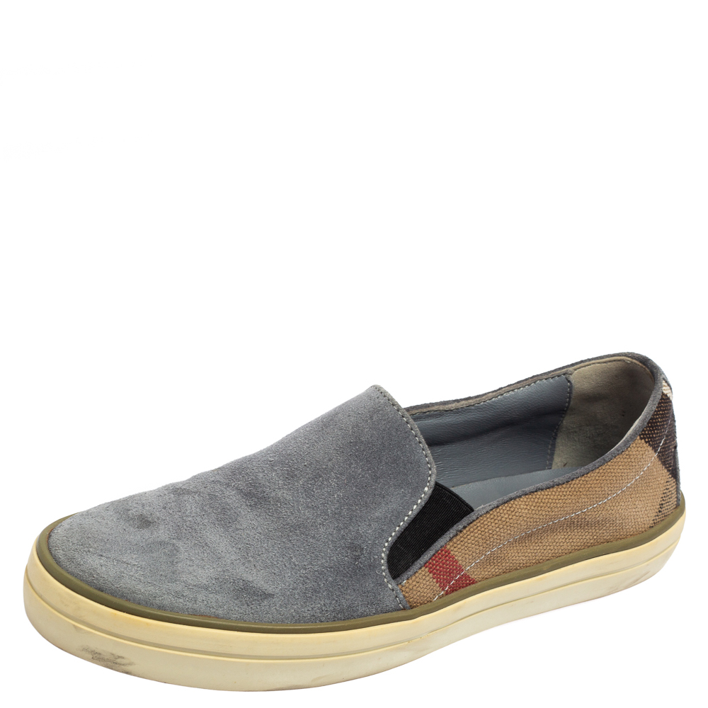 Stylish and super comfortable these slip on sneakers by Burberry will make a great addition to your shoe collection. They have been designed using the signature House Check canvas and suede and styled with round toes. Leather insoles and tough outsoles beautifully complete this fabulous pair.