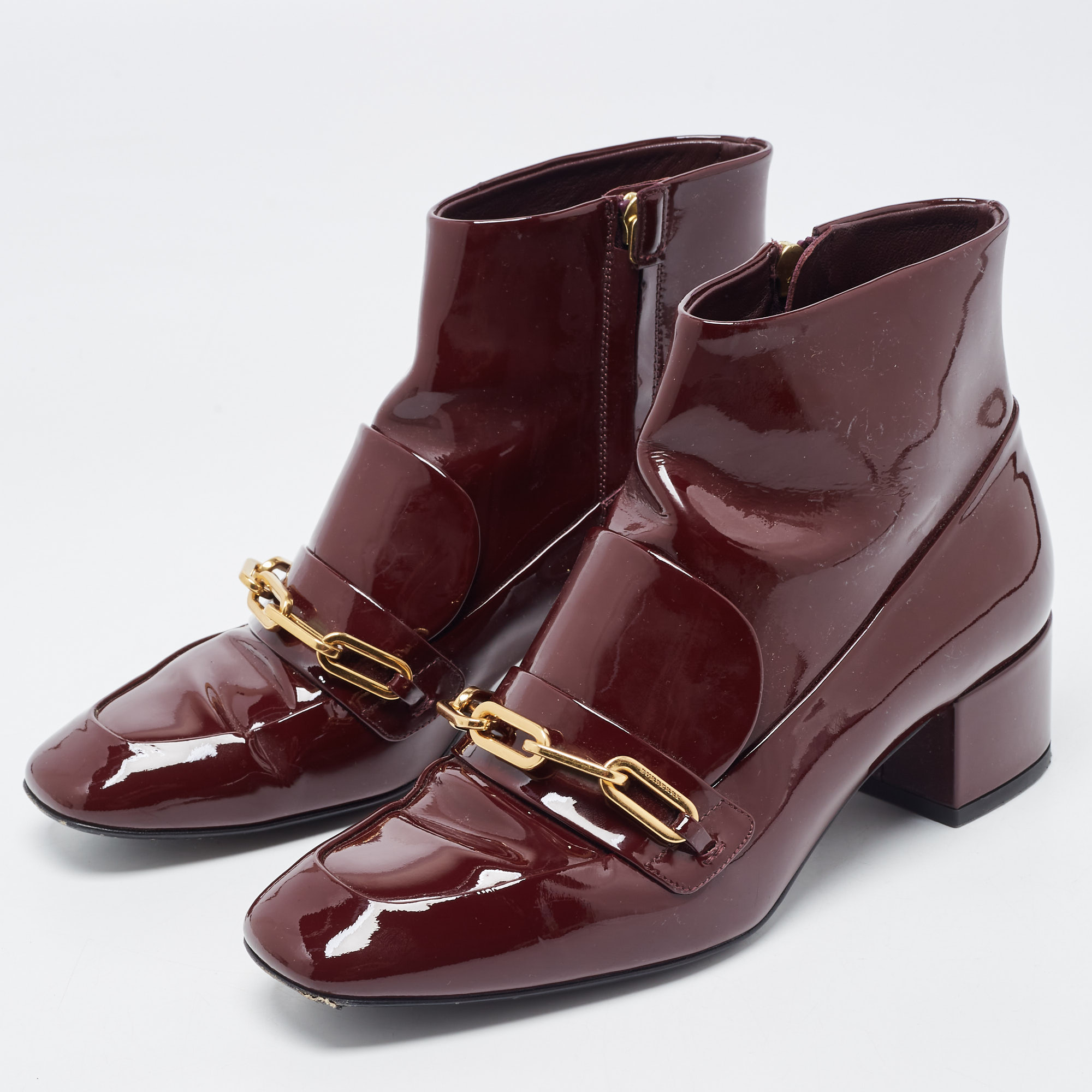 

Burberry Burgundy Patent Leather Chain Detail Ankle Boots Size