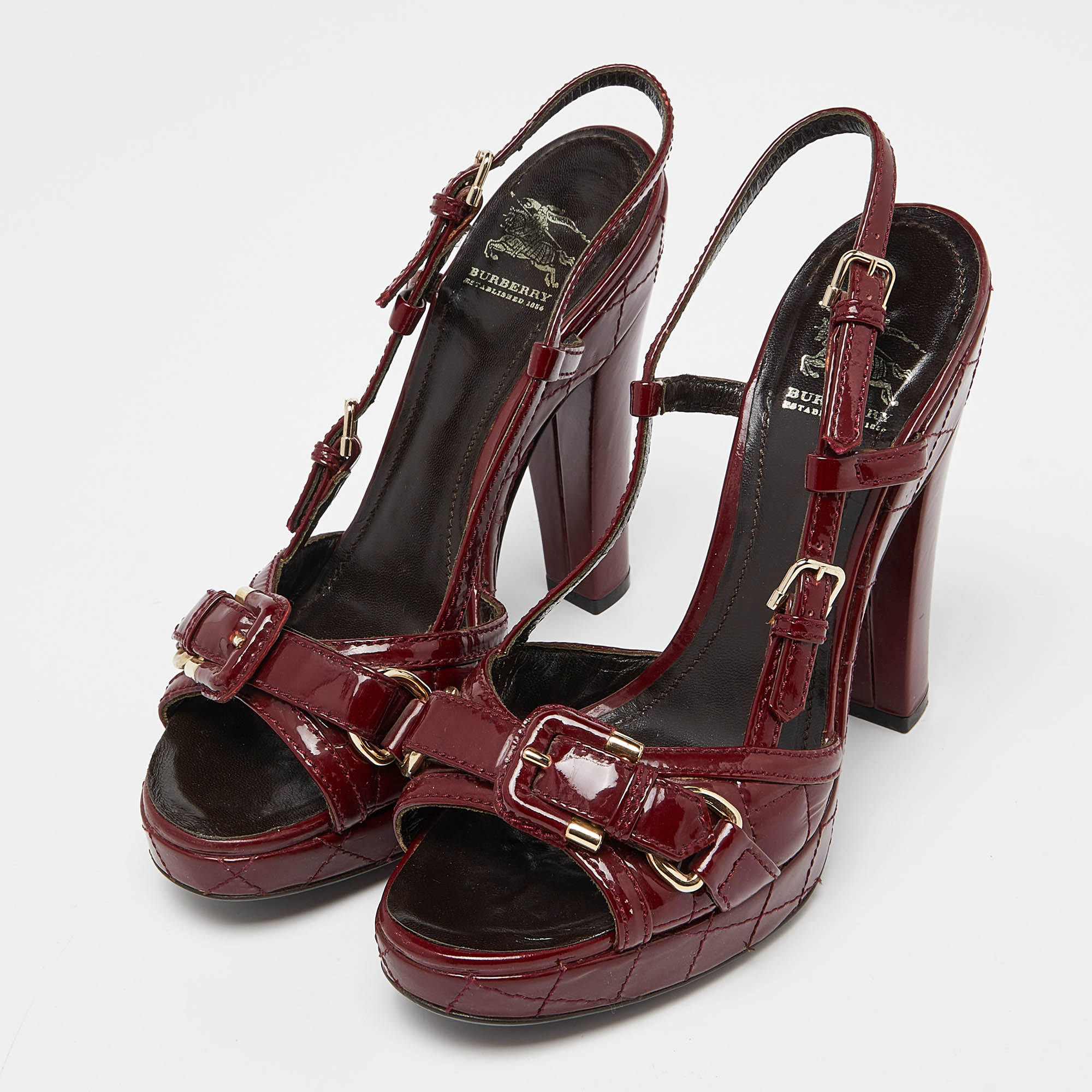 

Burberry Burgundy Quilted Patent Leather Buckle Detail Platform Slingback Sandals Size