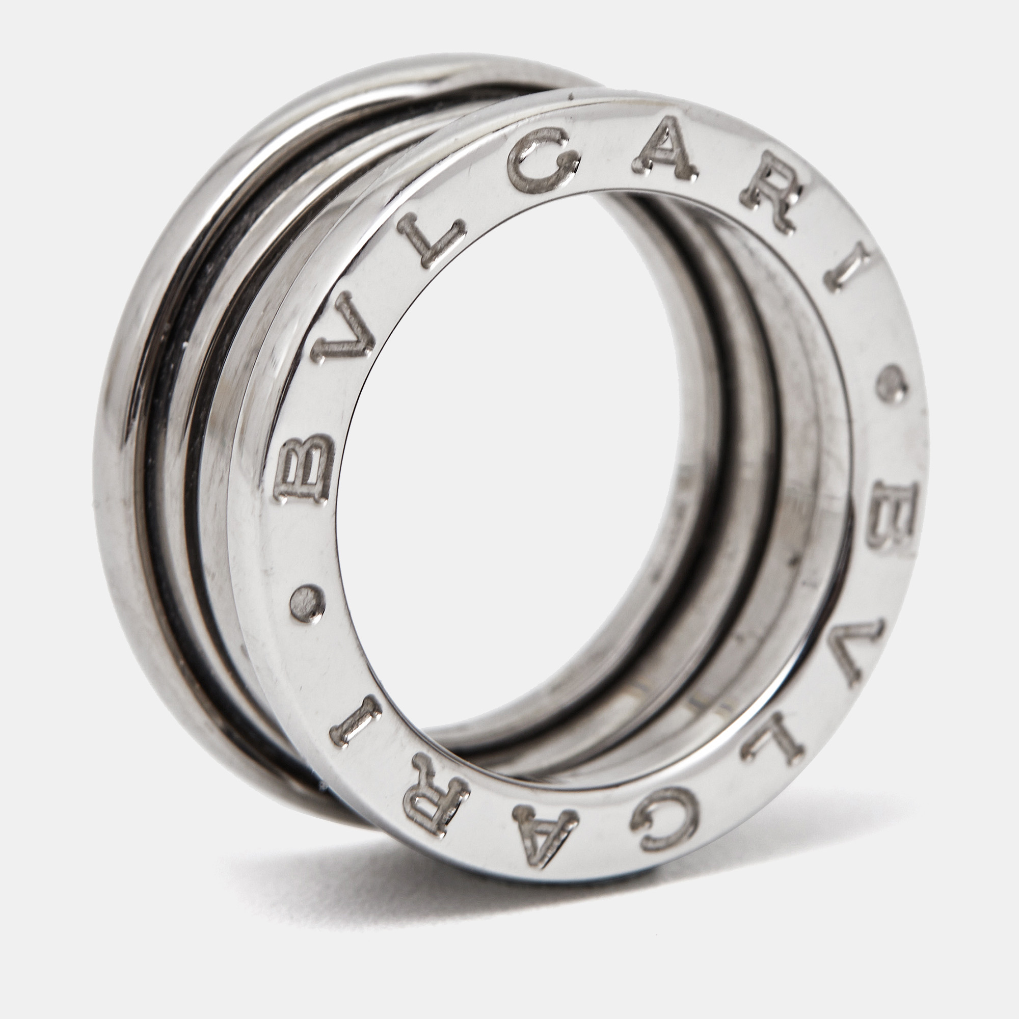 The Bvlgari B. Zero1 ring is a luxurious and iconic piece of jewelry. Crafted from exquisite 18k white gold it features four interlocking bands creating a contemporary and bold design. This timeless ring seamlessly combines elegance and modernity making it a coveted accessory for any fashion forward individual.