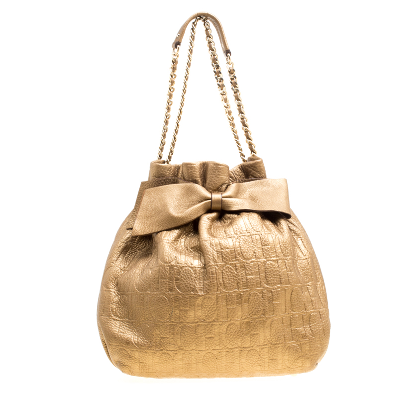 حقيبة كارولينا هيريرا باكت فيونكة جلد منقوشة مونوغرامية ذهبية
