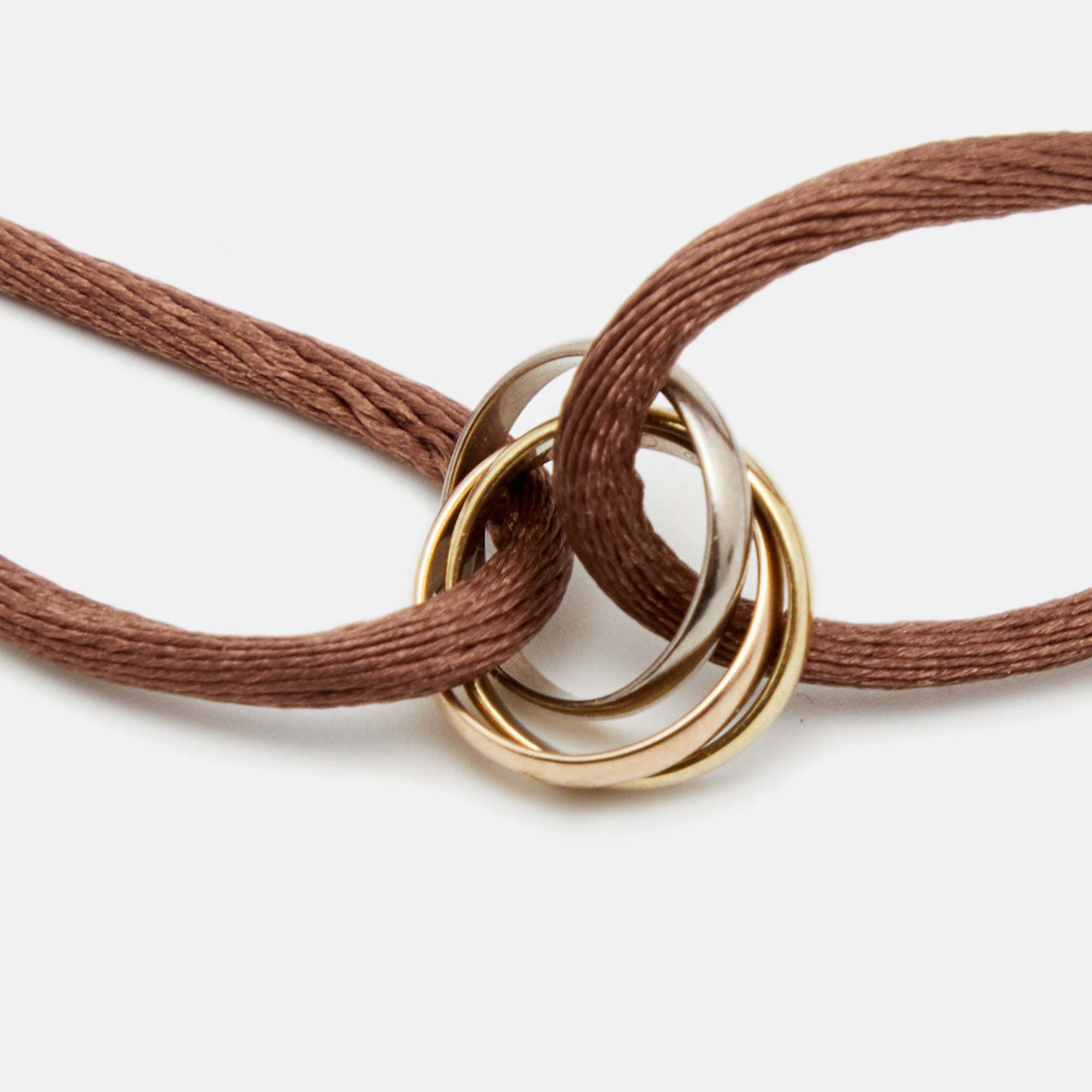 

Cartier Trinity 18k Three Tone Gold Adjustable Brown Cord Bracelet
