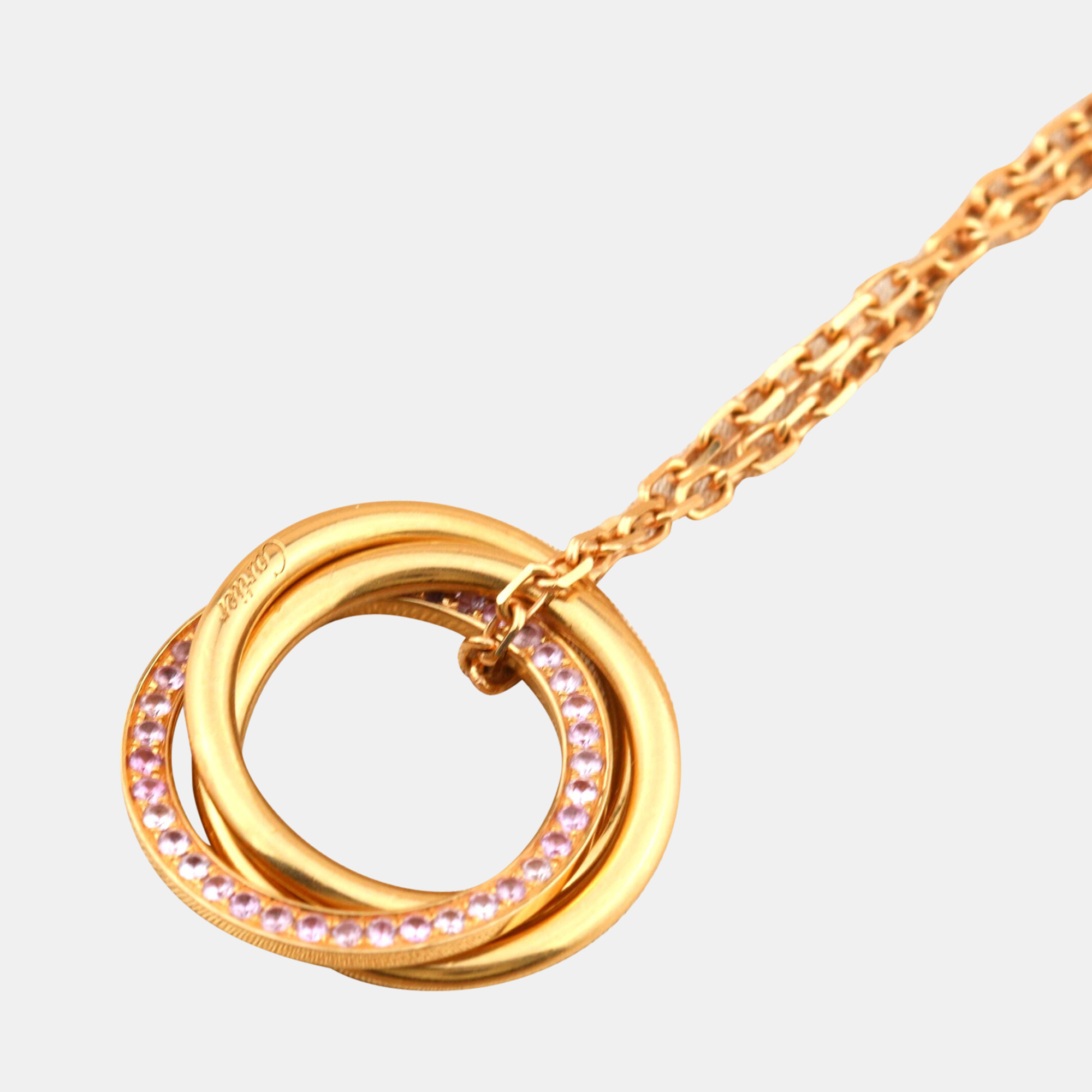 

Cartier White, Yellow, Rose Gold, and Pink Sapphire Trinity Pendant Necklace