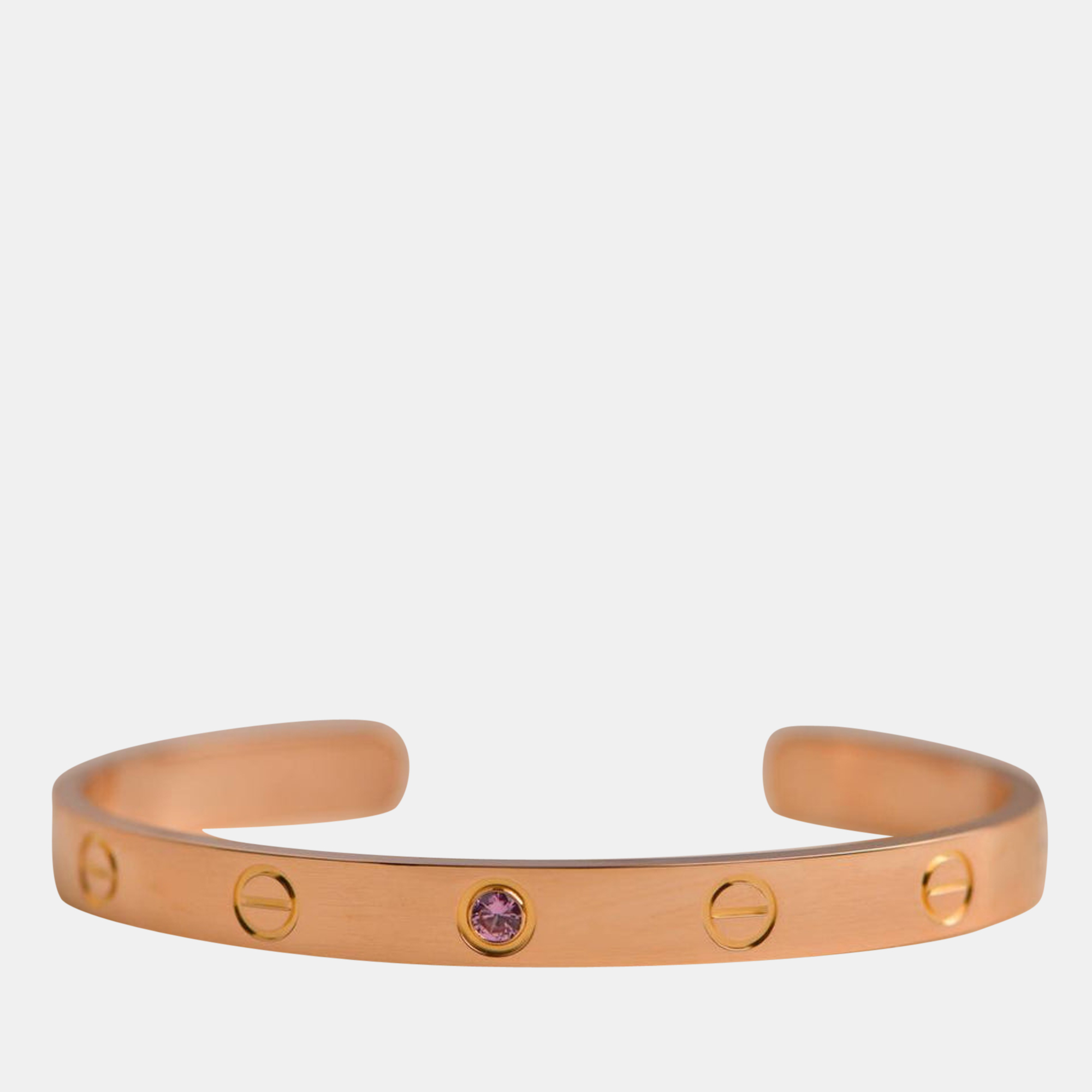 Cartiers Love bracelet is a modern symbol of luxury and a way to lock in ones love. Designed in an oval shape to comfortably sit around your wrist the iconic love handcuff is laid with distinct screw motifs and secured by screw closure.