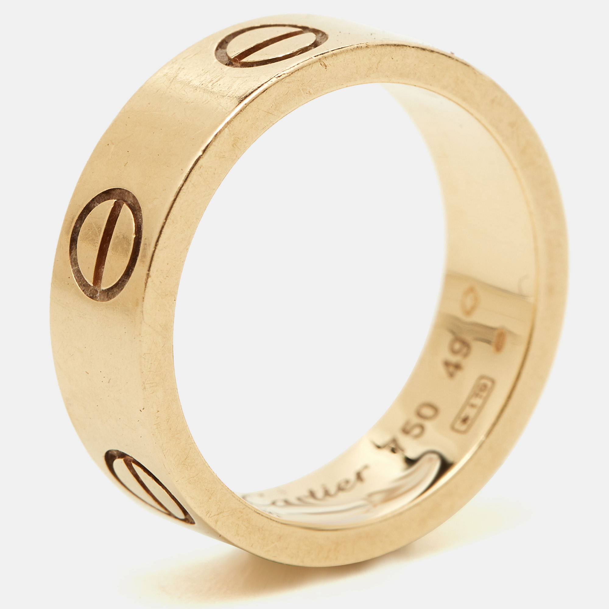 This stunning Love ring is an icon of style and luxury. Constructed in 18k yellow gold this ring features screw details all around the surface as symbols of a sealed and secured bond. This ring is sure to become your everyday essential.