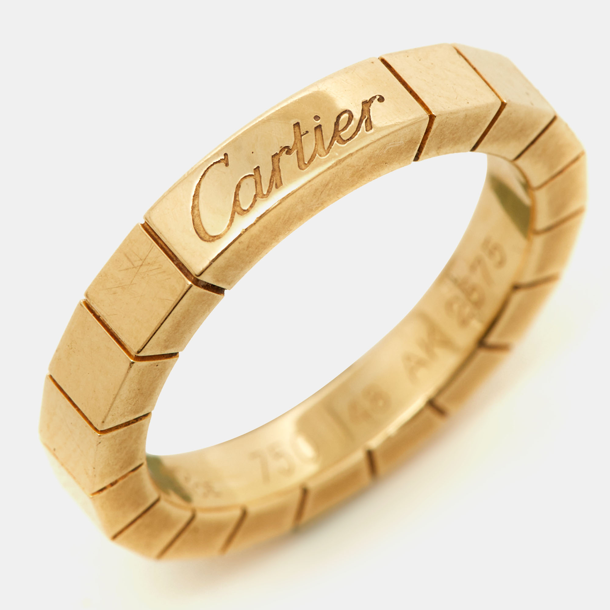 The Cartier Lanieres ring is a luxurious jewelry piece crafted from 18 karat yellow gold. This sleek and elegant design features thin parallel bands that wrap around the finger creating a modern and sophisticated look. Its a timeless and versatile accessory suitable for any occasion.