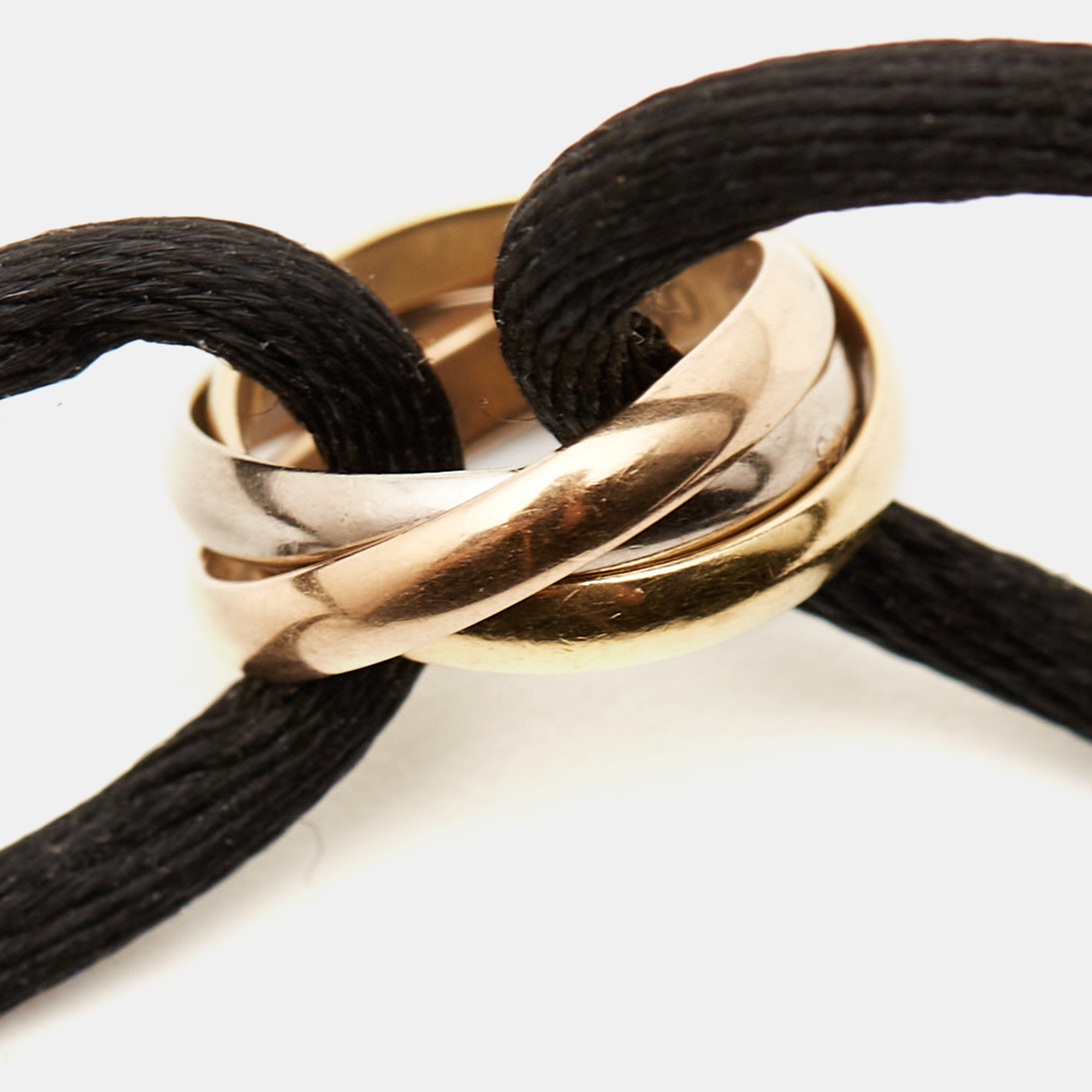 

Cartier Trinity 18k Three Tone Gold Adjustable Black Cord Bracelet