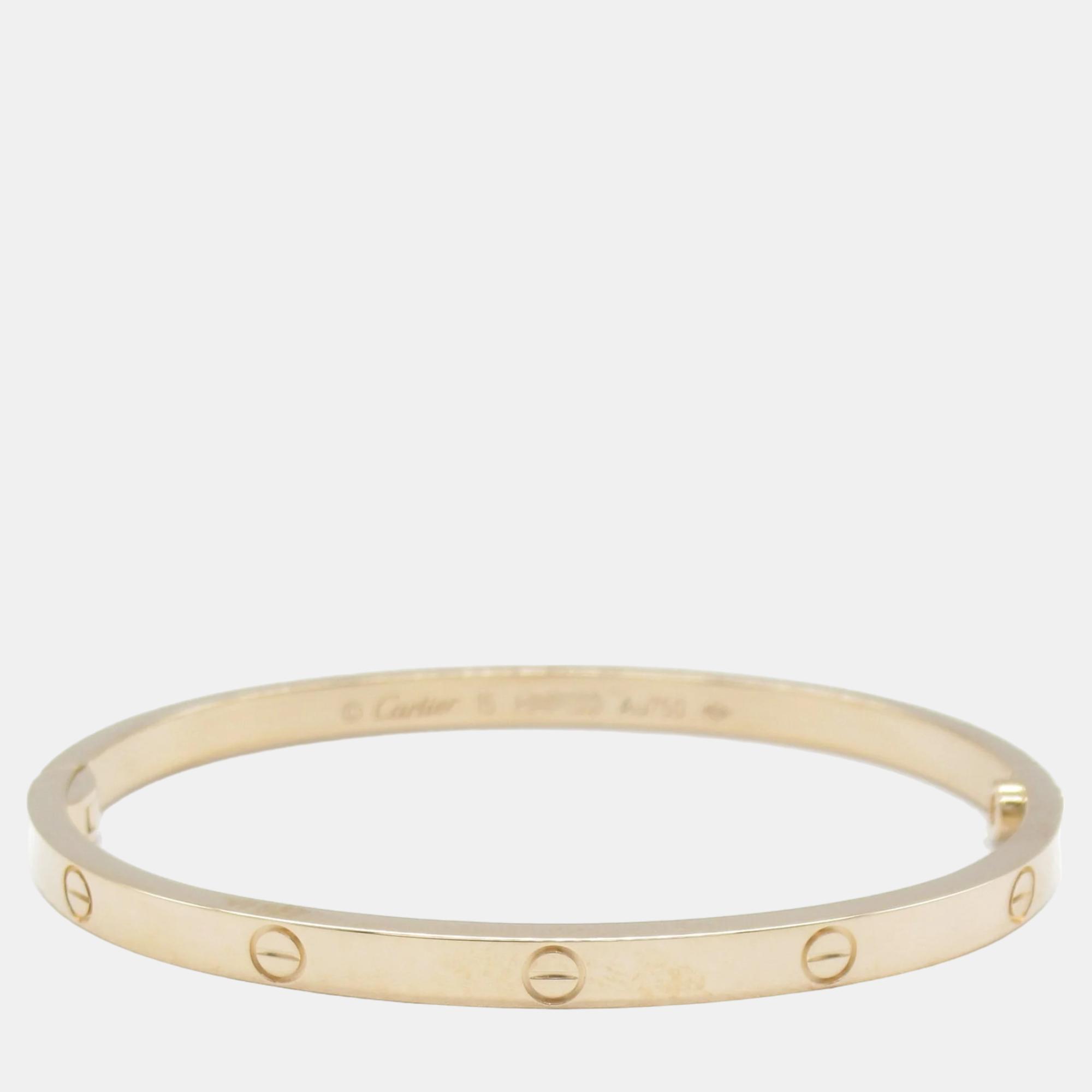Cartiers Love bracelet is a modern symbol of luxury and a way to lock in ones love. Designed in an oval shape to comfortably sit around your wrist the iconic love handcuff is laid with distinct motifs and secured by screw closure.
