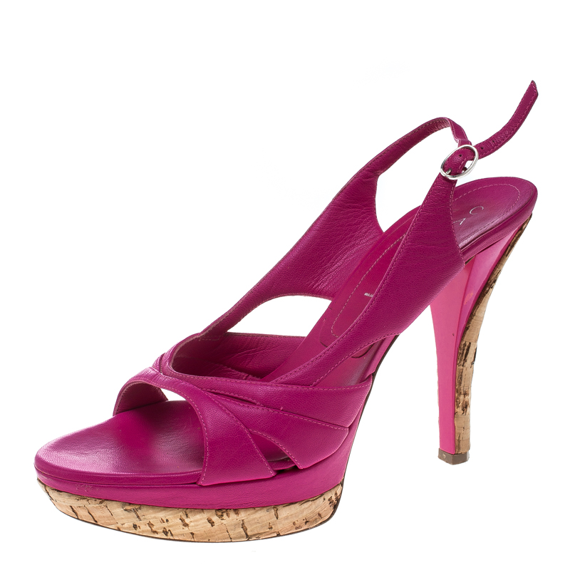 These stunning pink sandals from Casadei are sure to add some class to your outfits. They have been crafted from leather and feature an open toe silhouette. They flaunt intertwined vamp straps and come equipped with buckled slingbacks comfortable insoles 11.5 cm heels and platforms that offer maximum grip while walking. This is one pair you definitely need to own