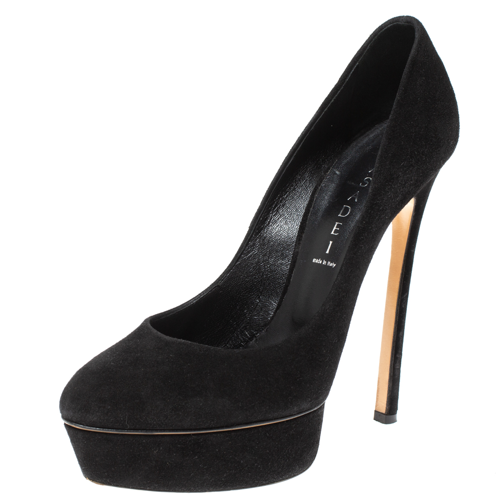 Add sophistication to your outfit with these Casadei Daisy pumps. Made from black colored suede they are coupled with round toes platforms and 15 cm heels. Leather lined their soles and insoles carry brand labels.