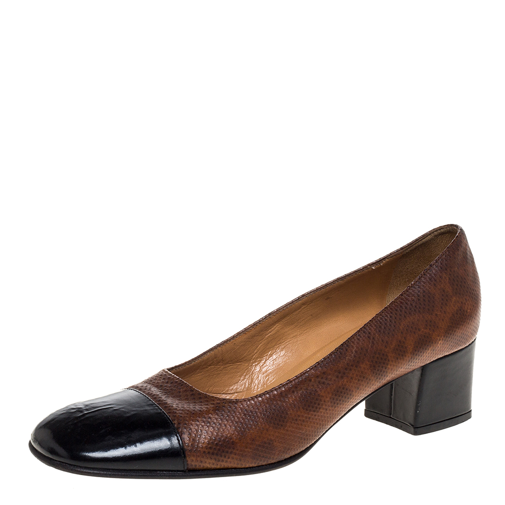 These stylish pumps come from the house of Casadei. Crafted from embossed leather featuring a lovely design and a brown hue they are absolute must haves. They are styled with black cap toes low heels and durable leather soles.