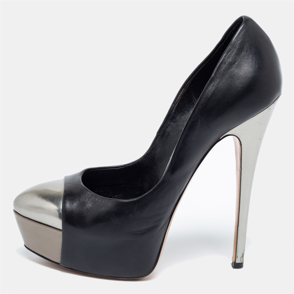 The silver trims against the black exterior lend this pair of Casadei pumps an elegant contrast. Created from leather it will add an extra dose of style to your outfit. The 15cm heels are supported on platforms to offer you the perfect balance and posture.