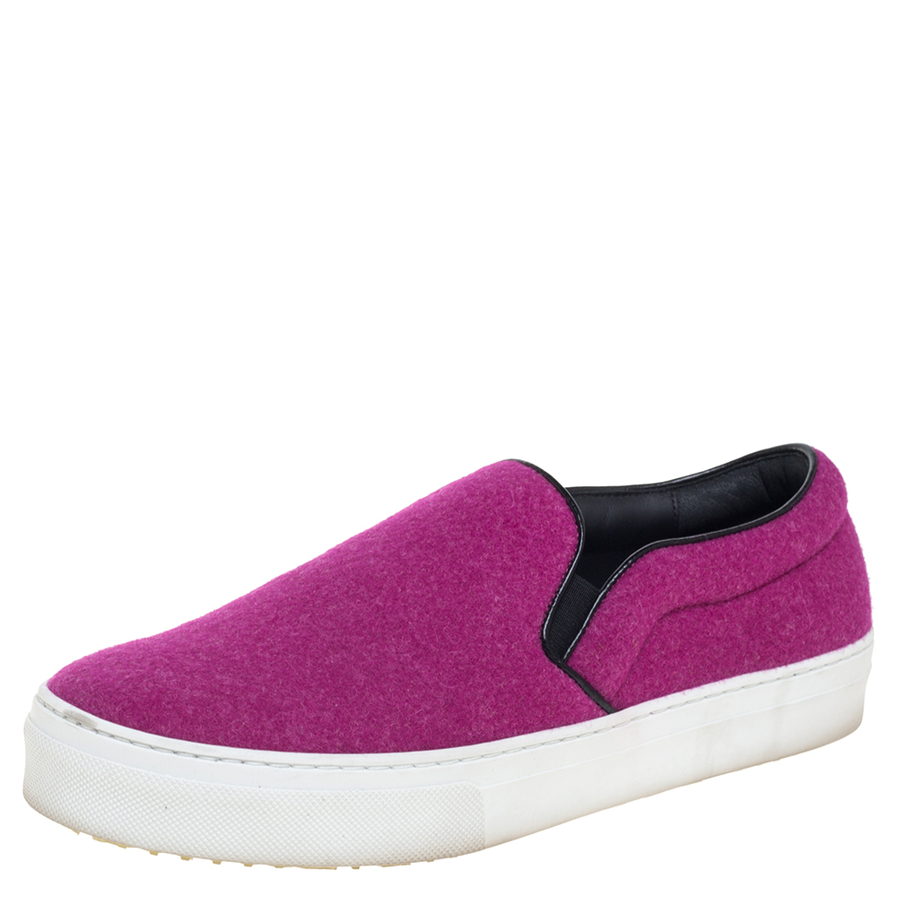 Make an amazing style statement in these slip on sneakers from Celine. They have been crafted from pink wool and styled with round toes. They come equipped with comfortable leather lined insoles and thick rubber soles. Grab them right away