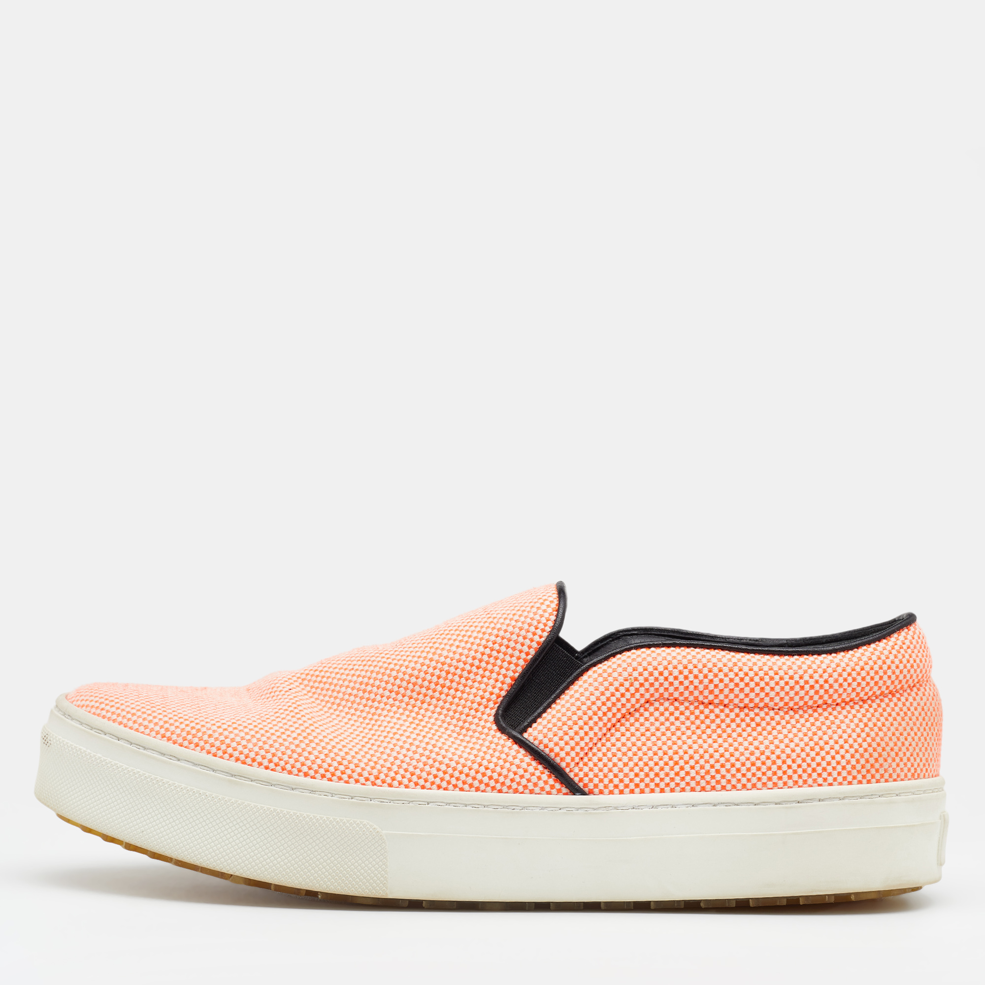 To accompany your attires with ease Celine brings you this pair of sneakers that speak nothing but comfort. Theyve been crafted from orange canvas and made ready with round toes leather insoles and rubber soles.