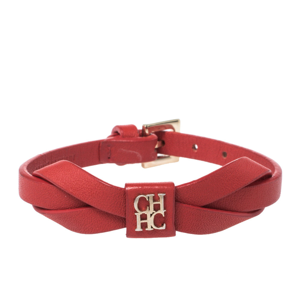 Click to view more detailed imagery on our partner's website Pre-owned Ch Carolina Herrera Red Leather Ribbon Motif Gold Tone Bracelet