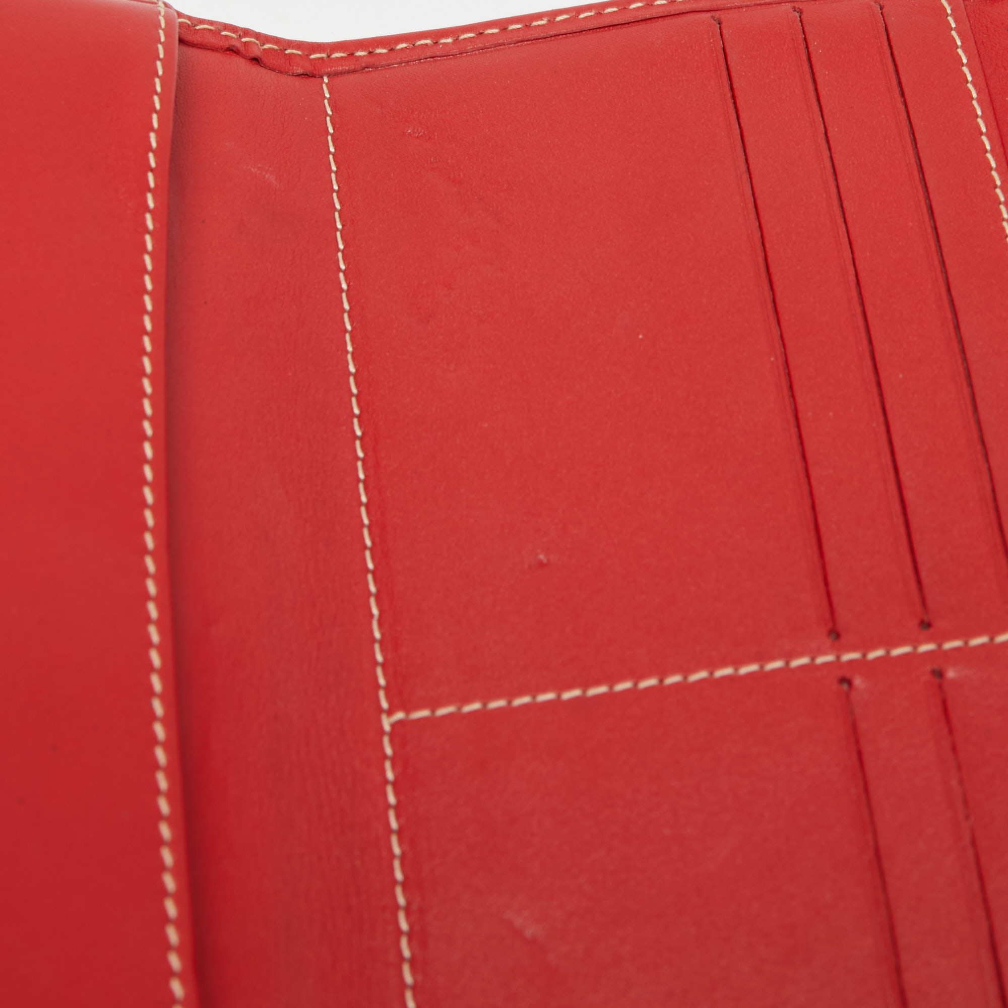 

Carolina Herrera Red Monogram Embossed Leather Flap Continental Wallet