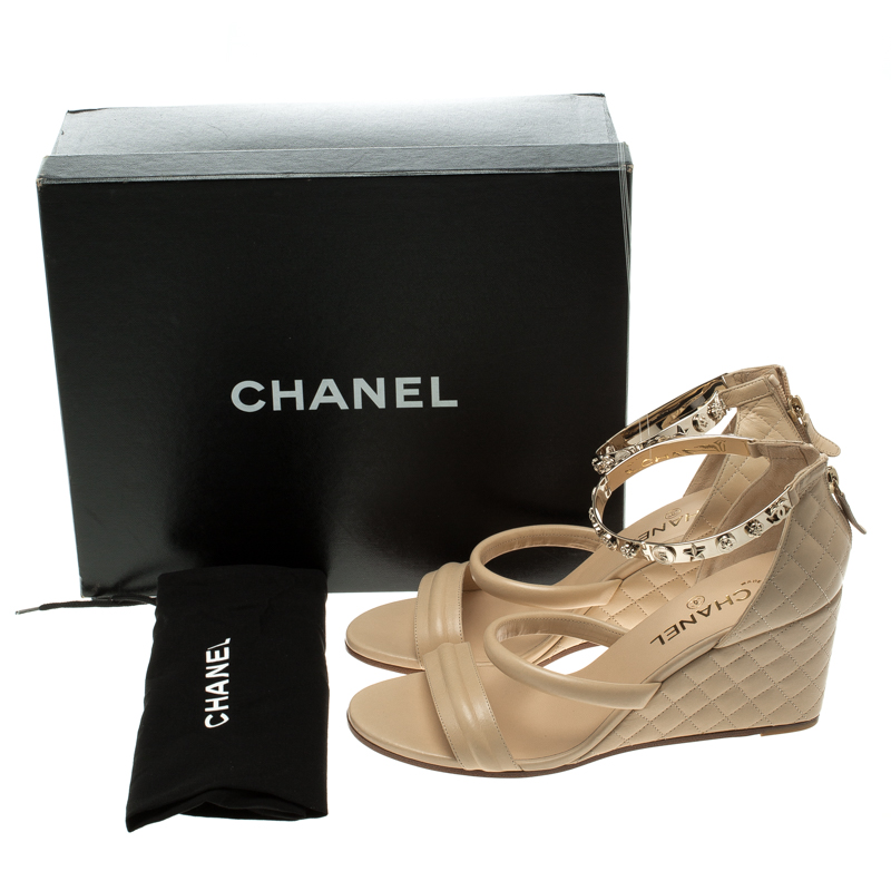 Chanel Beige Quilted Leather Charm Embellished Ankle Cuff Wedge Sandals