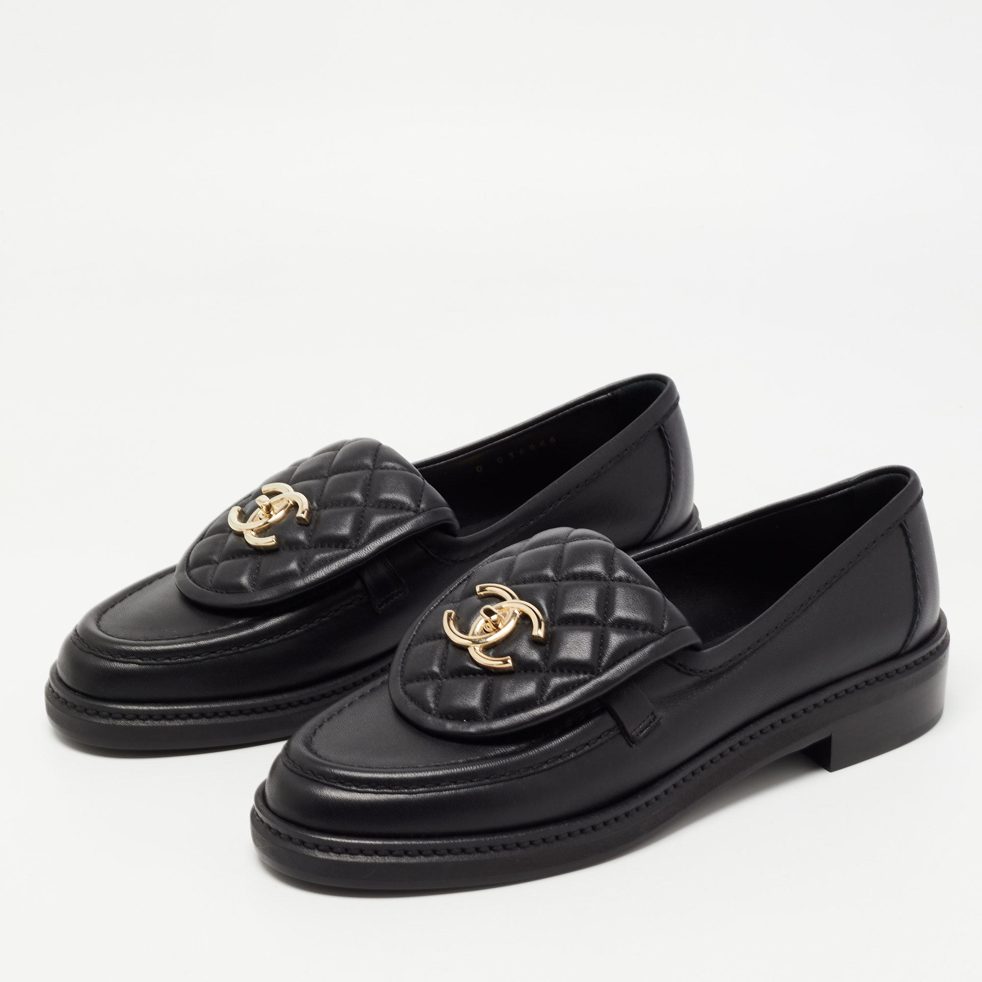 

Chanel Black Leather and Quilted Flap Turn Lock CC Loafers Size