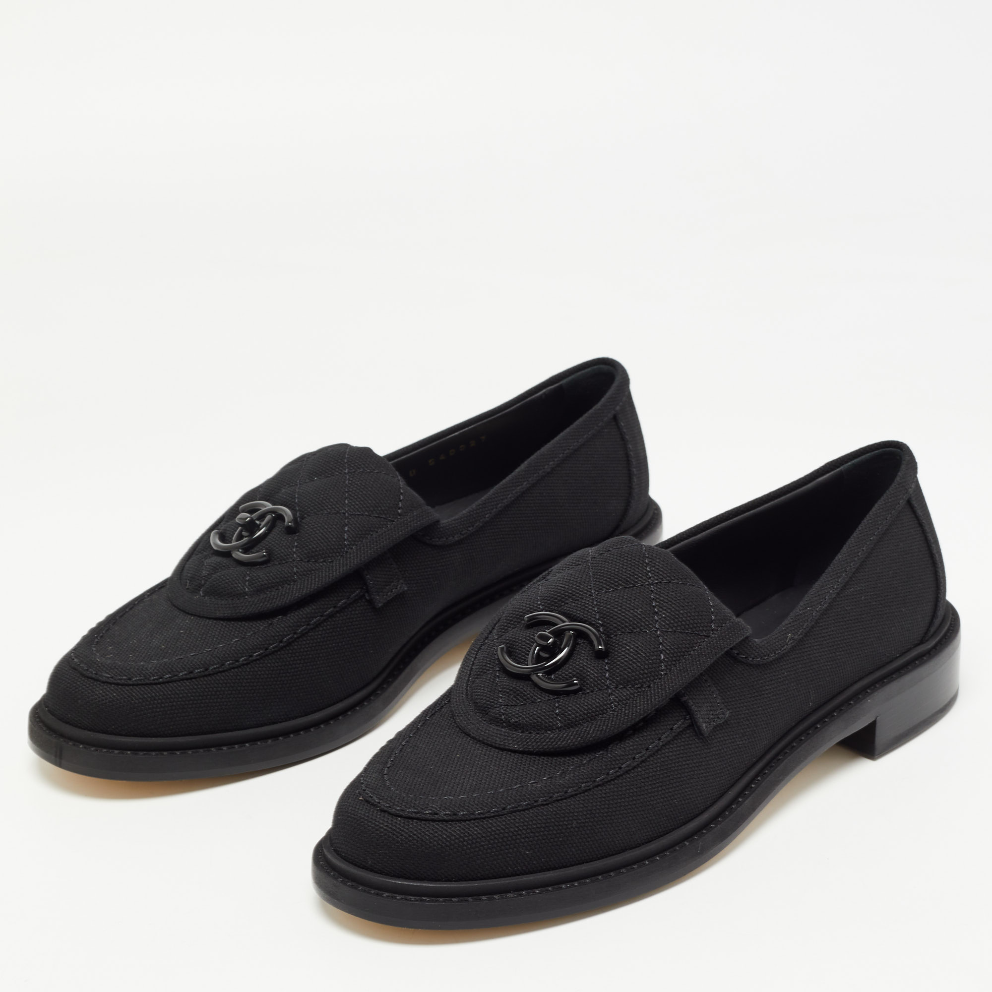 

Chanel Black Canvas Quilted CC Slip On Loafers Size