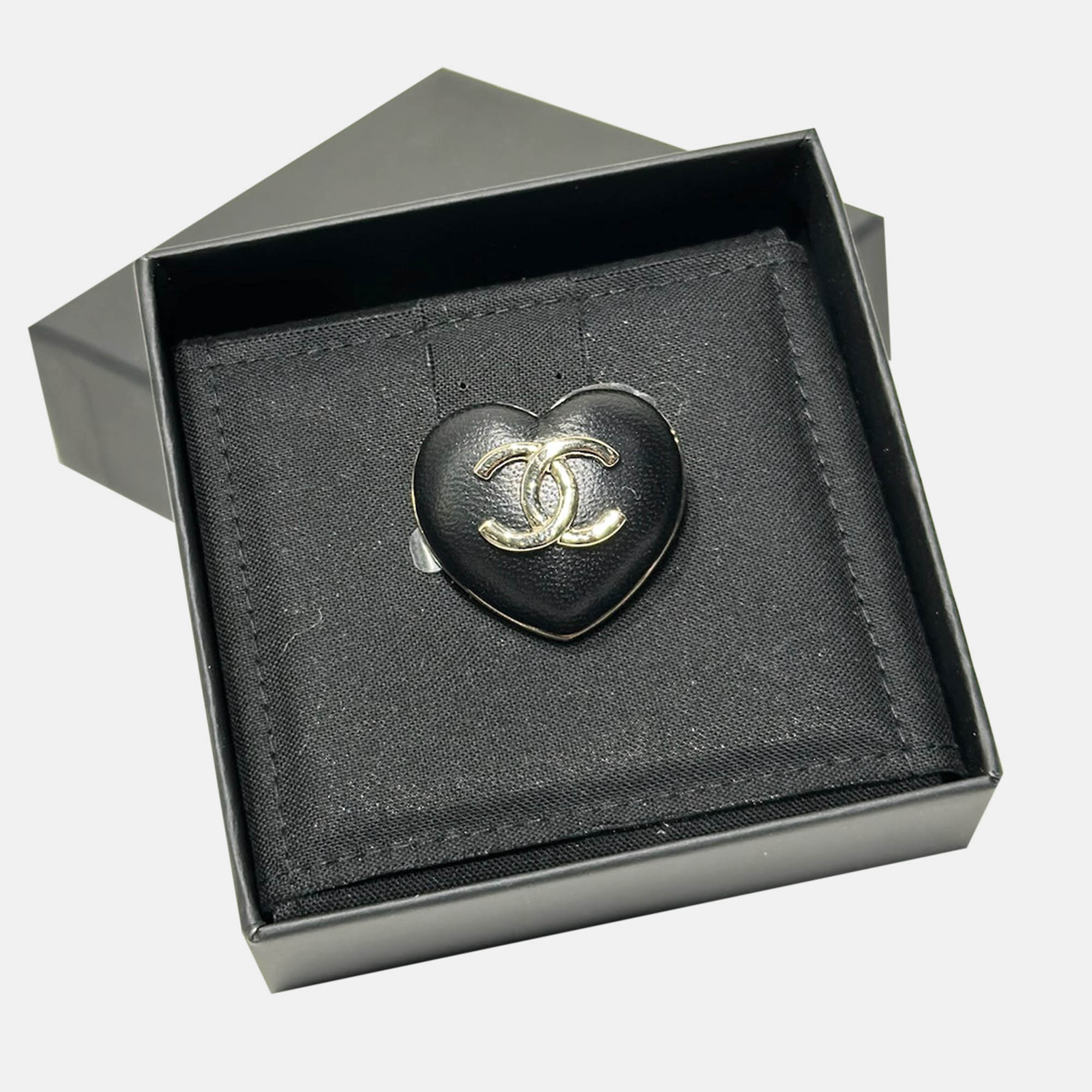 

Chanel 22K black leather love brooch