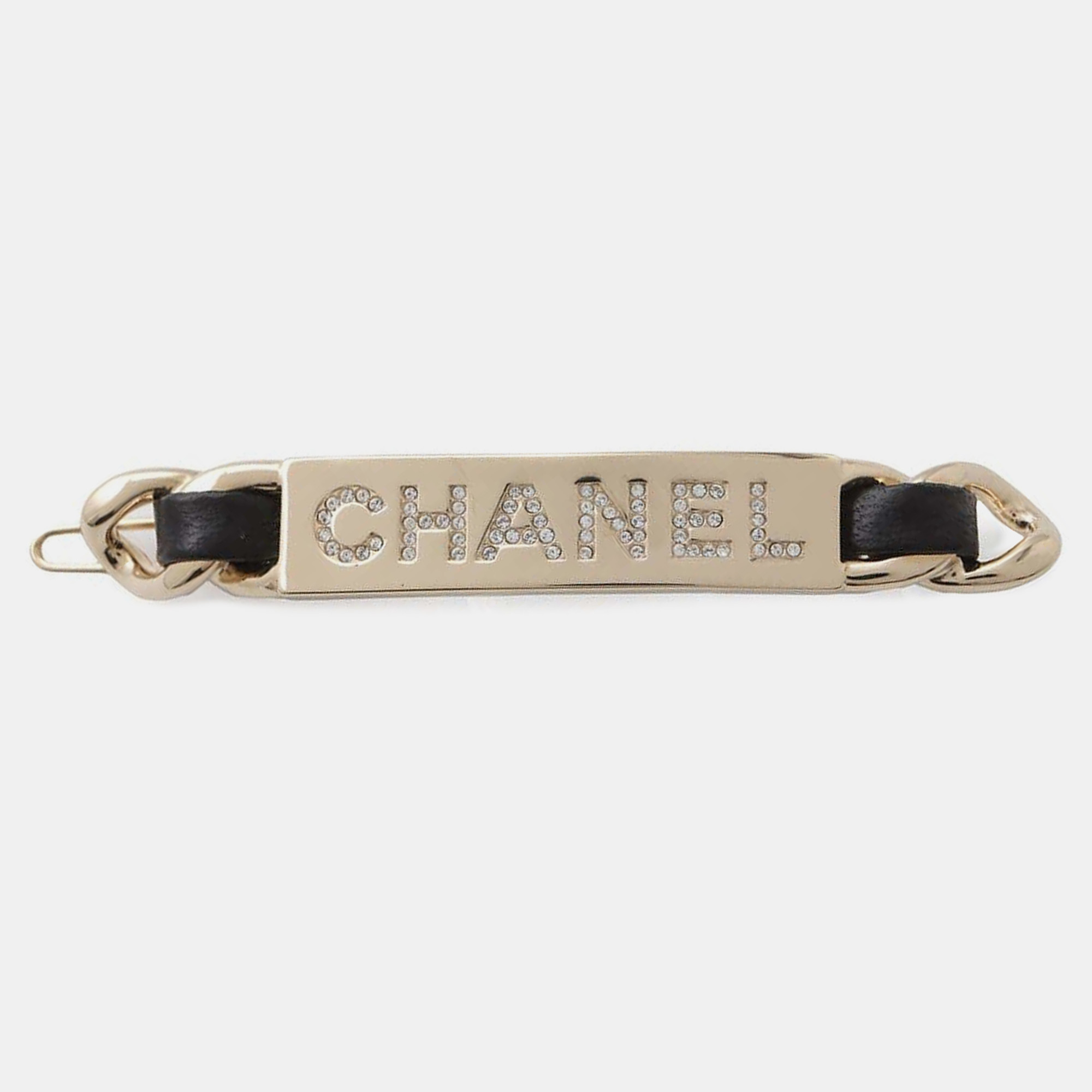 

Chanel Gold Plated and Leather Rhinestone Logo Hair Clip