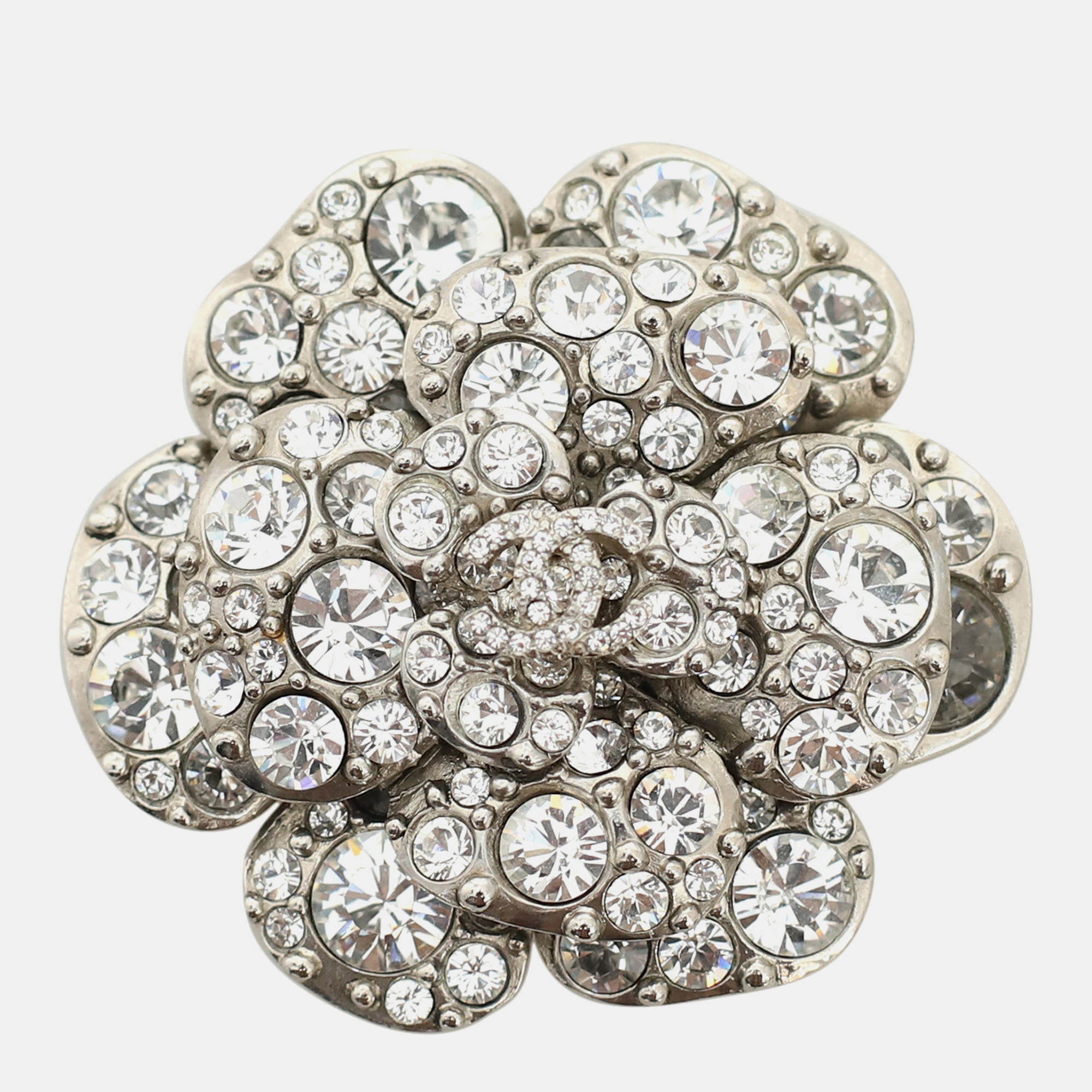 

Chanel Silver Metal and Crystal Embellishments Camelia CC Brooch