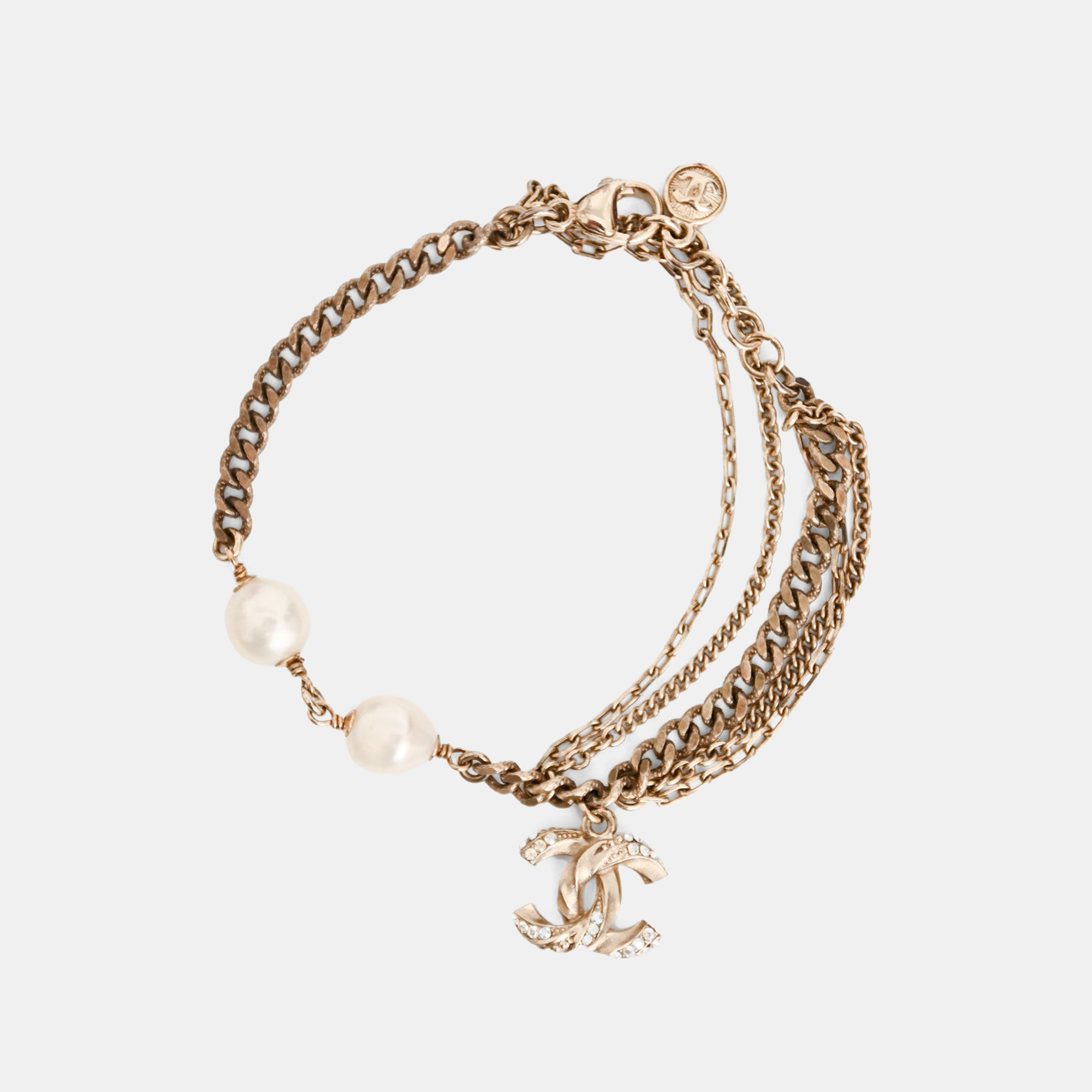 

Chanel 2012 Gold Tone Metal/Faux Pearl CC Bracelet