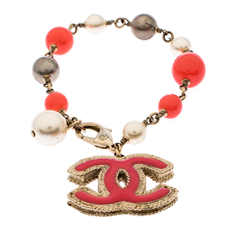 

Chanel CC Pink Enamel Faux Pearl Bead Gold Tone Charm Bracelet