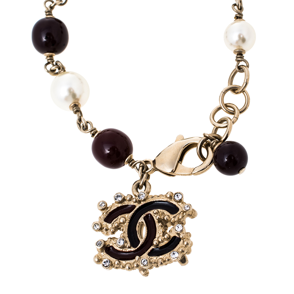 

Chanel Pale Gold Tone Burgundy & Cream Beaded CC Charm Bracelet