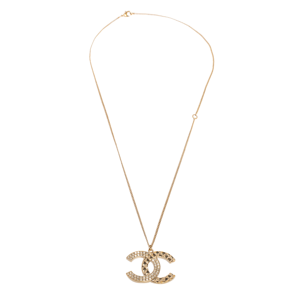 

Chanel Gold Tone Baguette Crystal & Quilt Patterned CC Pendant Necklace
