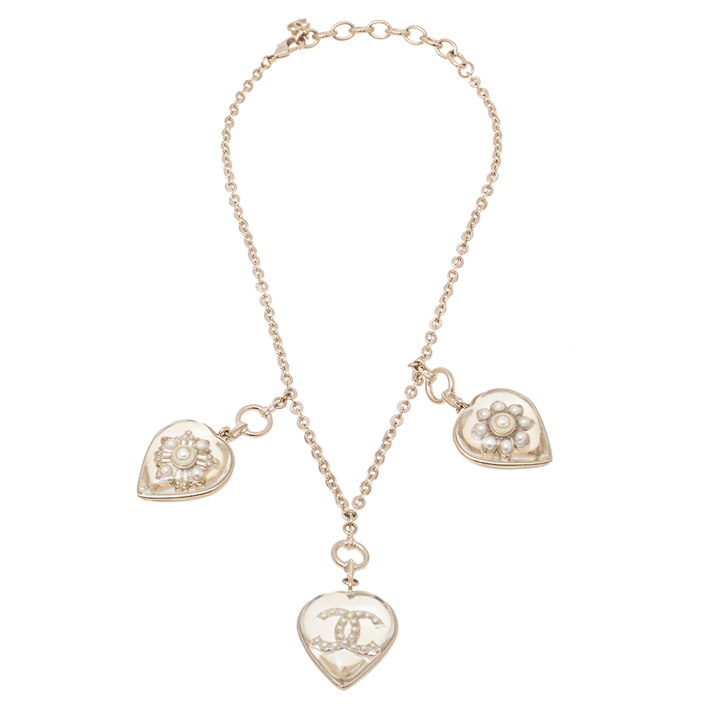 

Chanel CC Aged Gold Tone Metal Motif Embedded Resin Heart Pendants Necklace