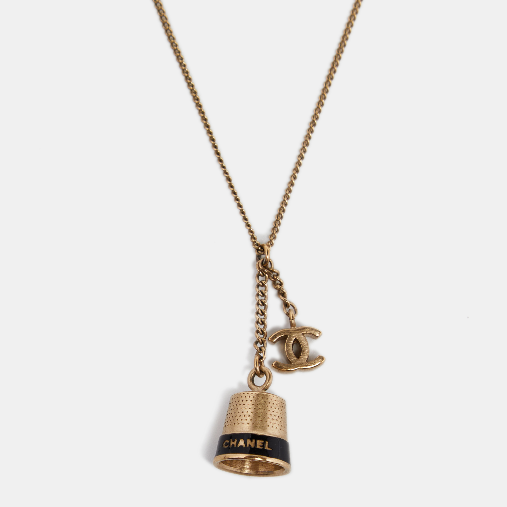 

Chanel Gold Tone Bell & CC Charm Pendant Necklace