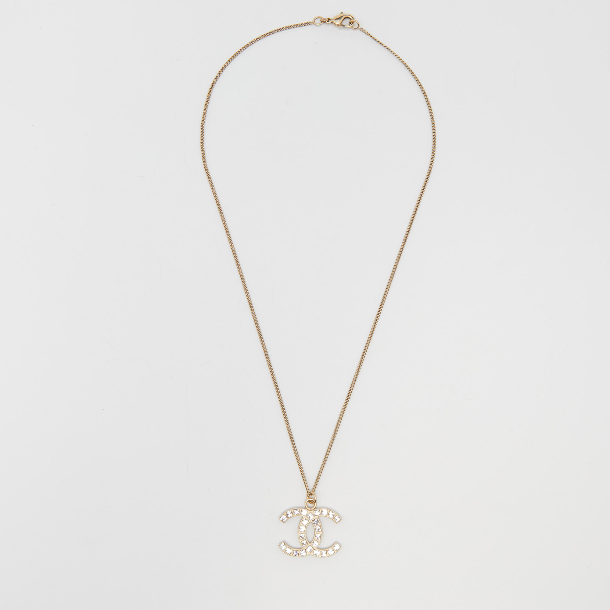 

Chanel Gold Tone Baguette Crystal CC Pendant Necklace