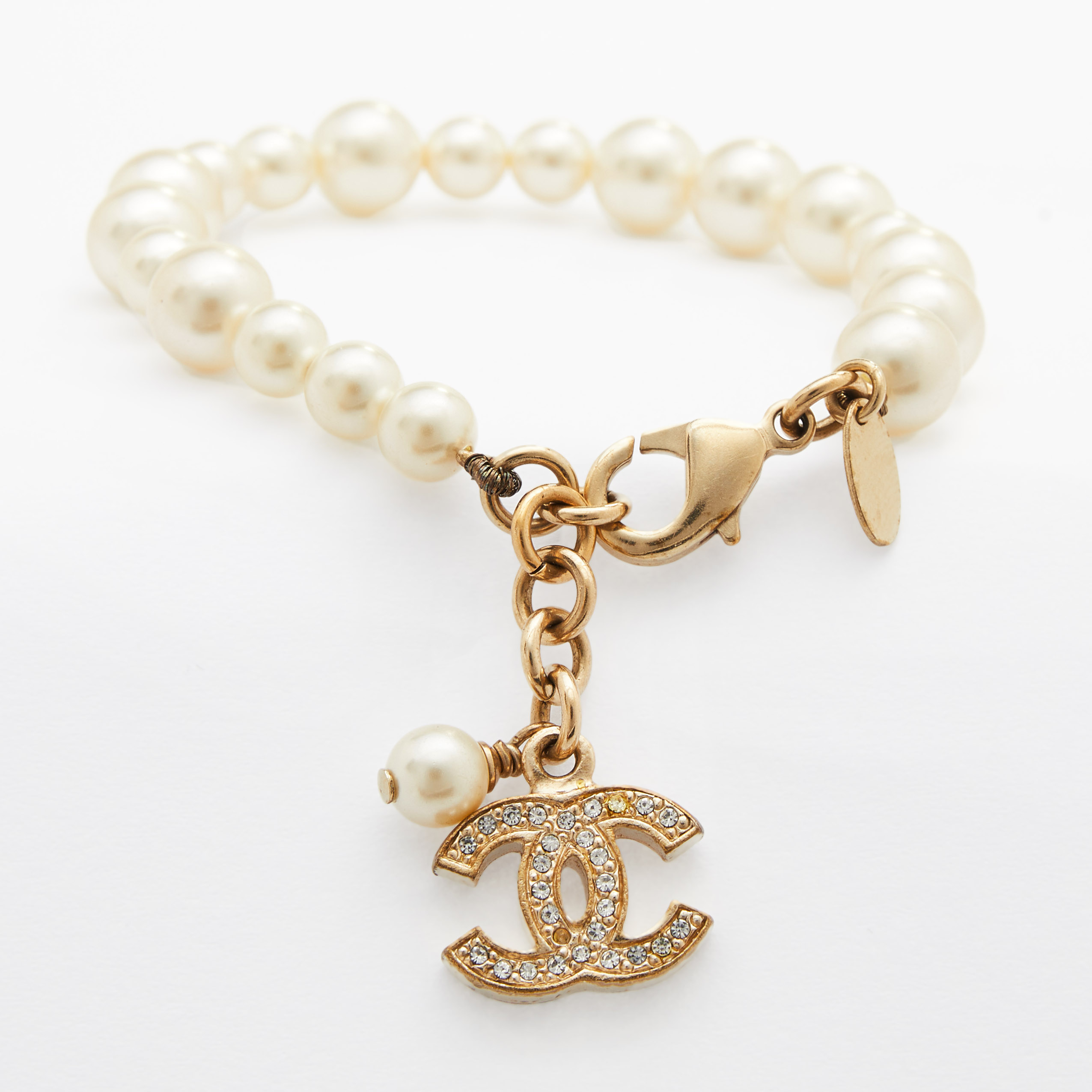 Pre Owned Chanel Gold Tone Faux Pearl Crystal CC Charm Bracelet