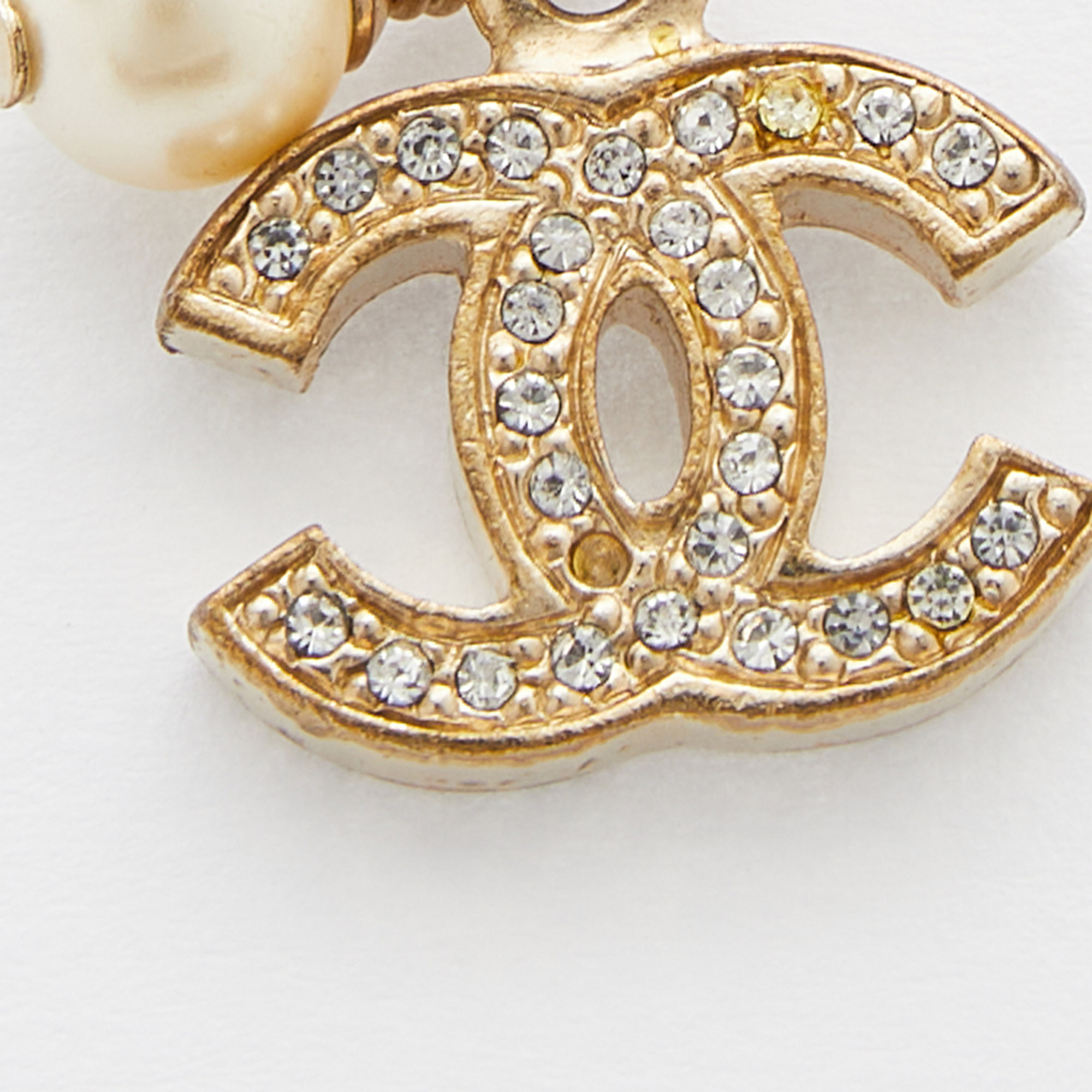 

Chanel Gold Tone Faux Pearl Crystal CC Charm Bracelet