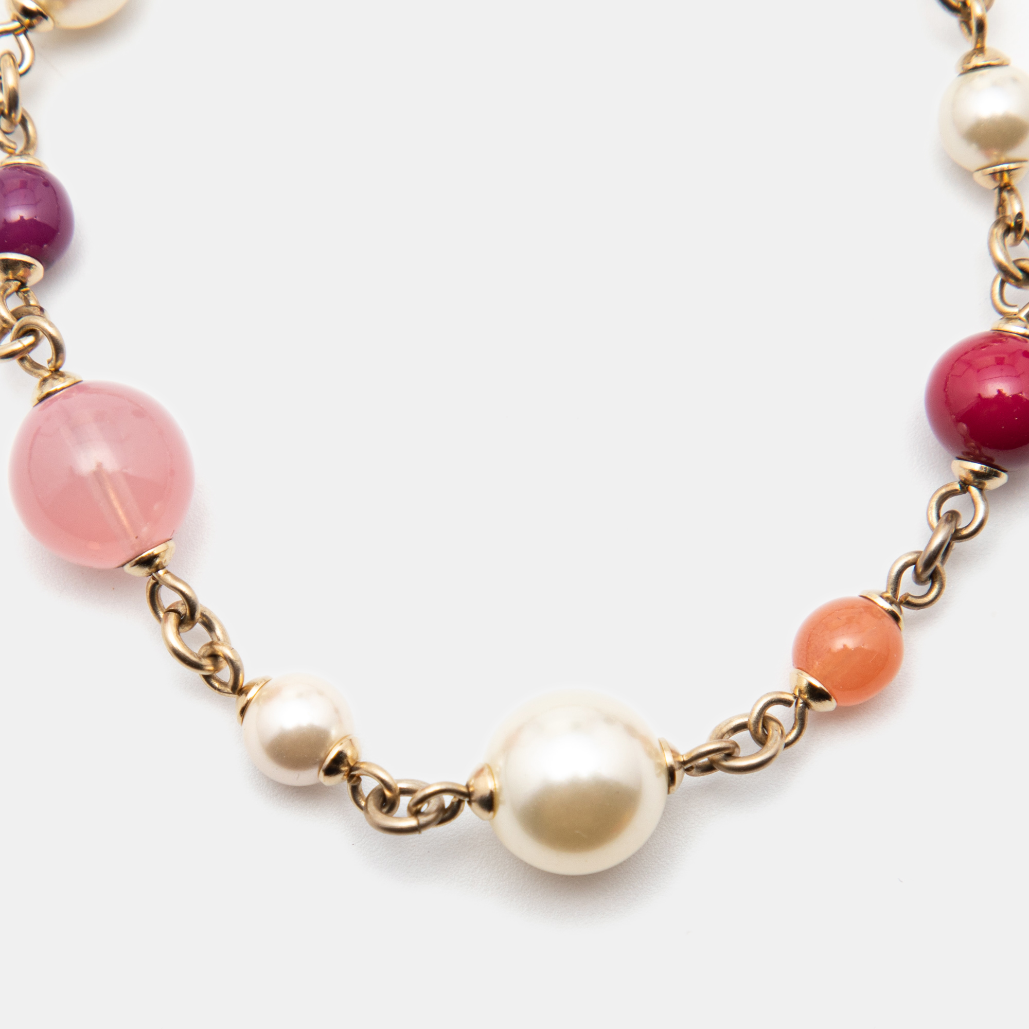 

Chanel Gold Tone Pink Beaded CC Charm Bracelet