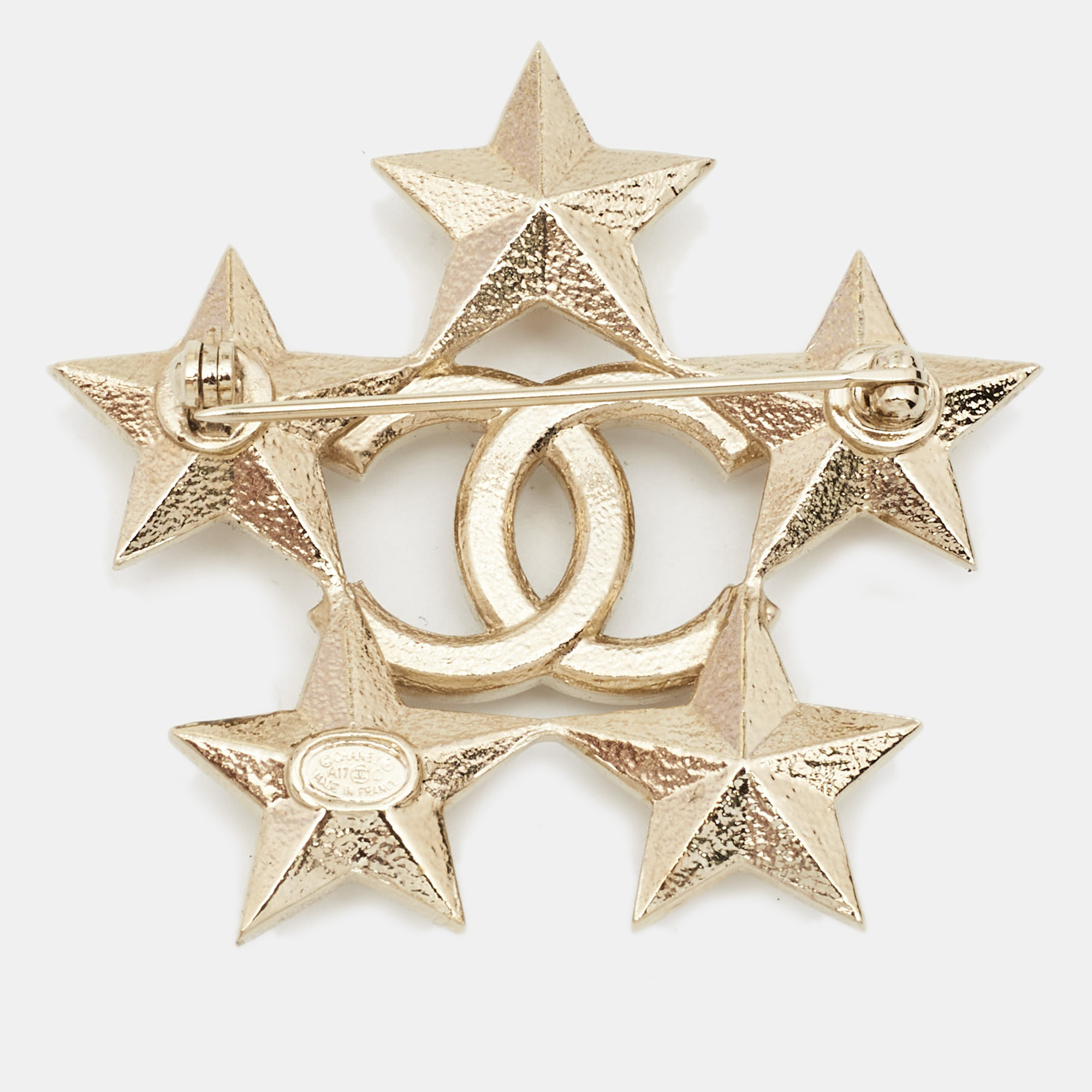 

Chanel Gold Tone Baguette Crystal CC Star Pin Brooch