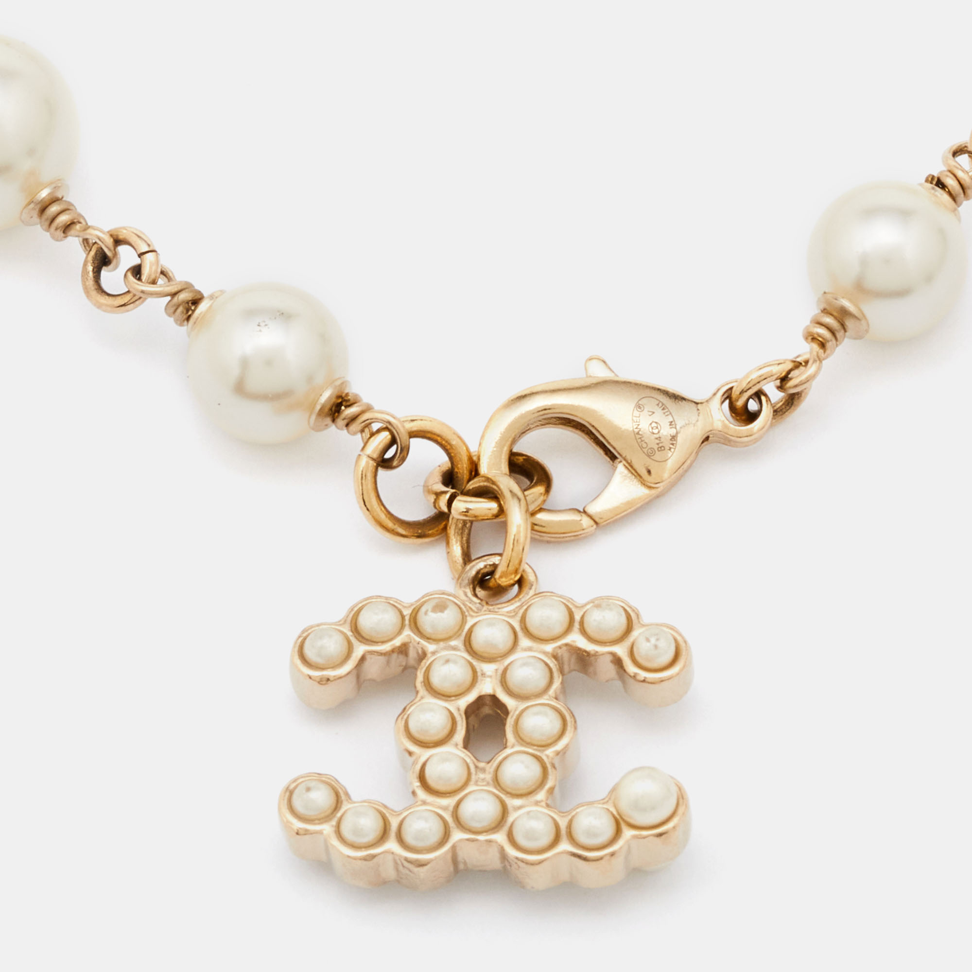 

Chanel Gold Tone Faux Pearl CC Charm Bracelet