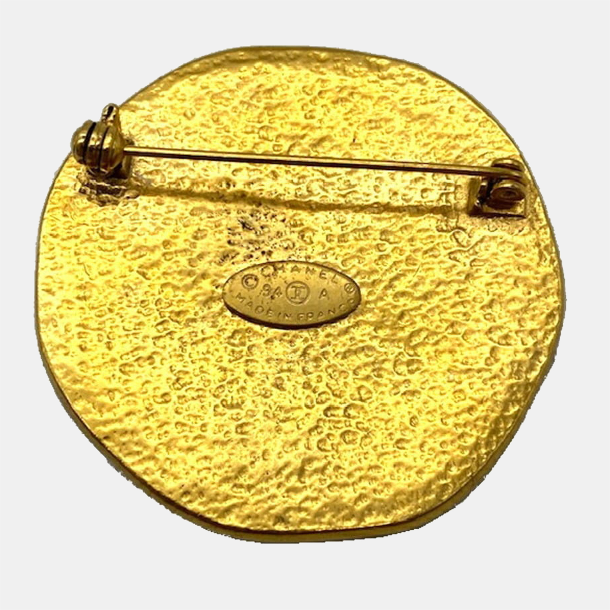 

Chanel Yellow Gold Tone Metal CC Sun Brooch