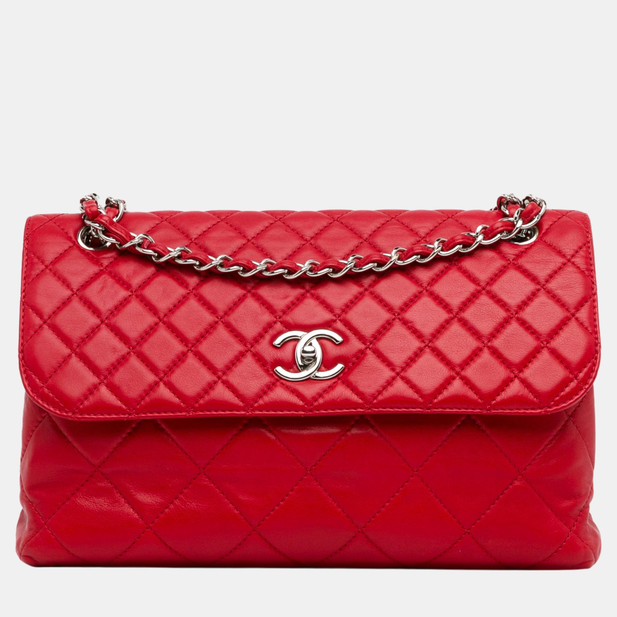 This flap bag features a quilted leather body leather woven chain straps a front flap with a twist lock closure an exterior back slip pocket and interior zip and slip pockets.