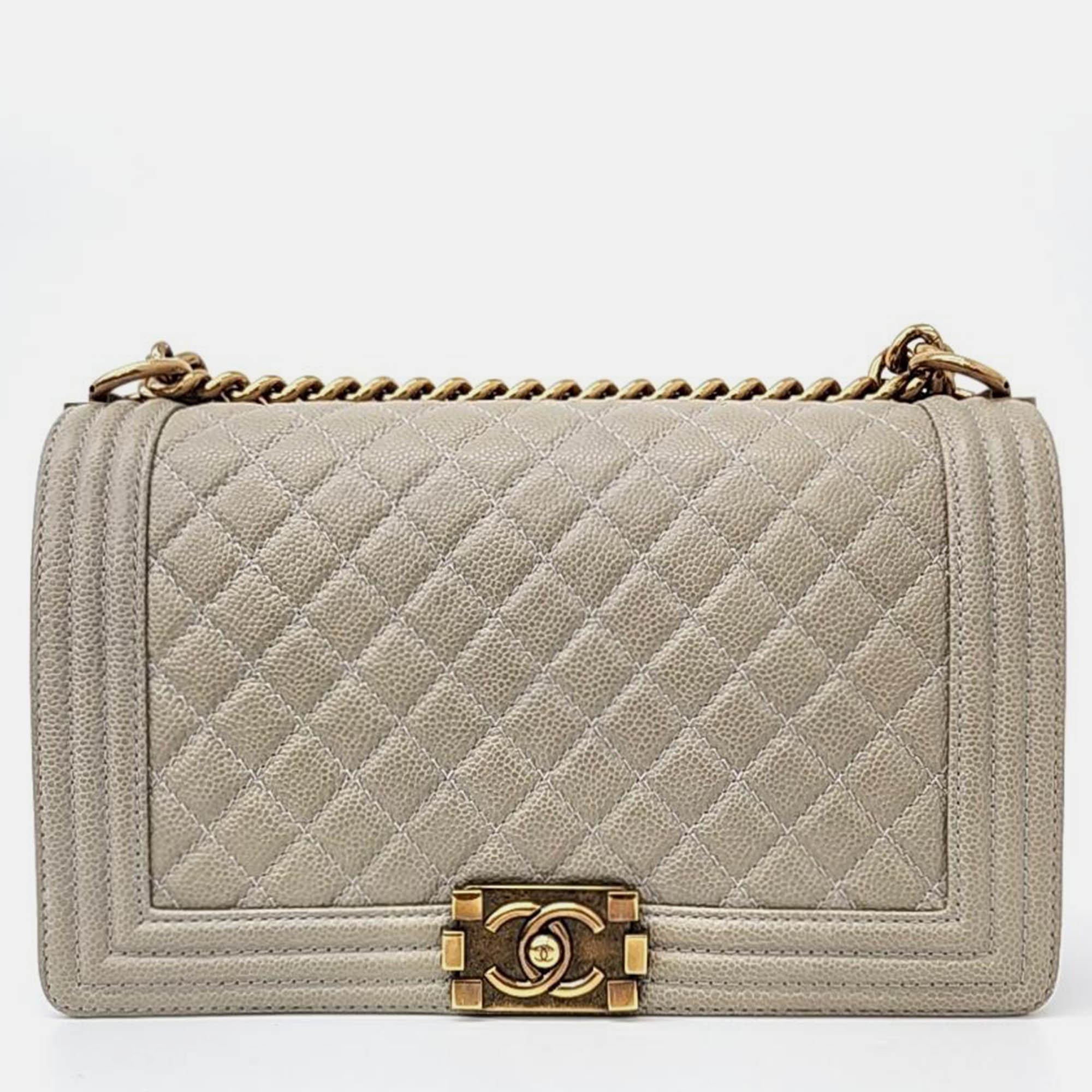 

Chanel Beige Caviar Leather Boy Medium HandBag