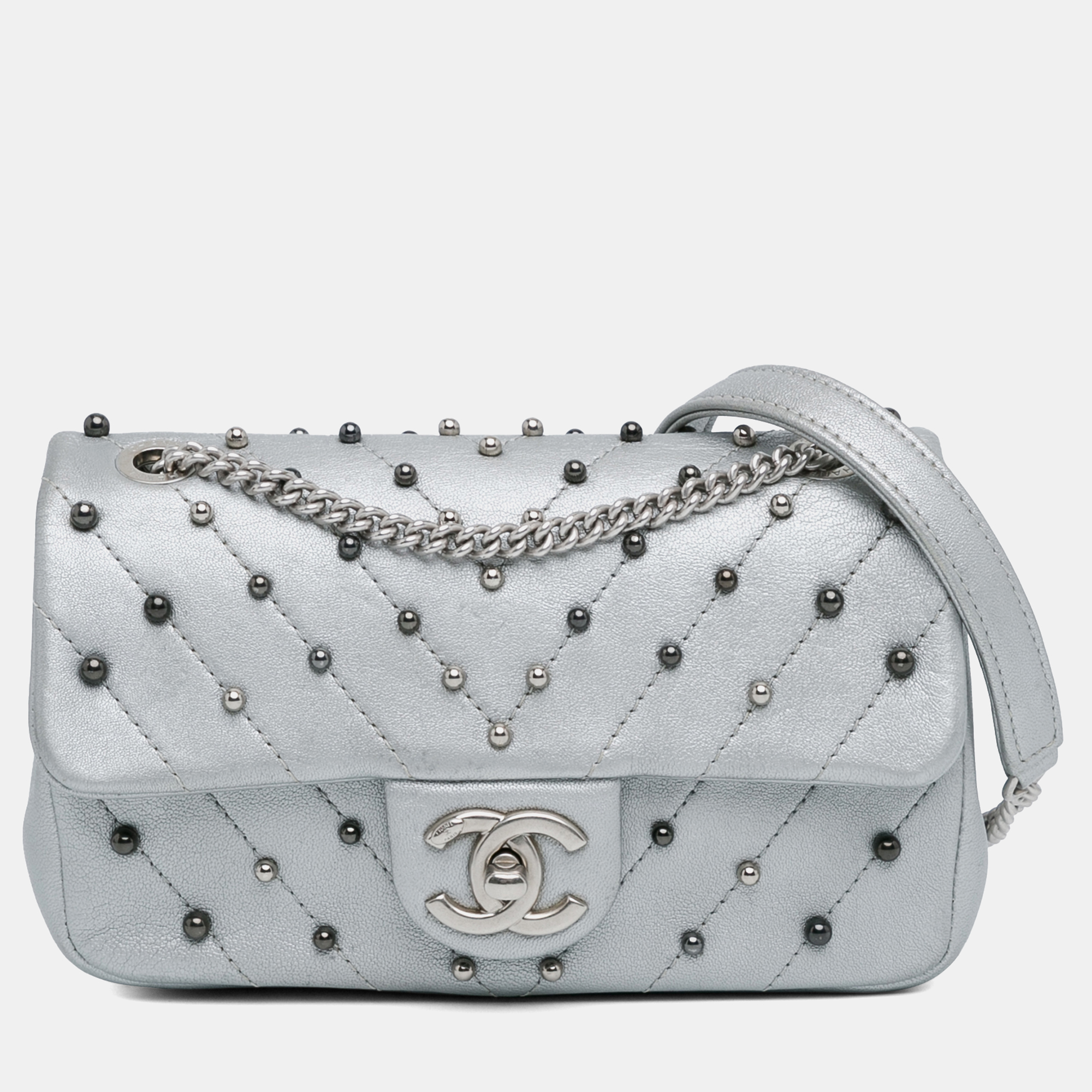 

Chanel Silver Lambskin Leather Mini Rectangular Chevron Quilted Stud Wars Flap Bag