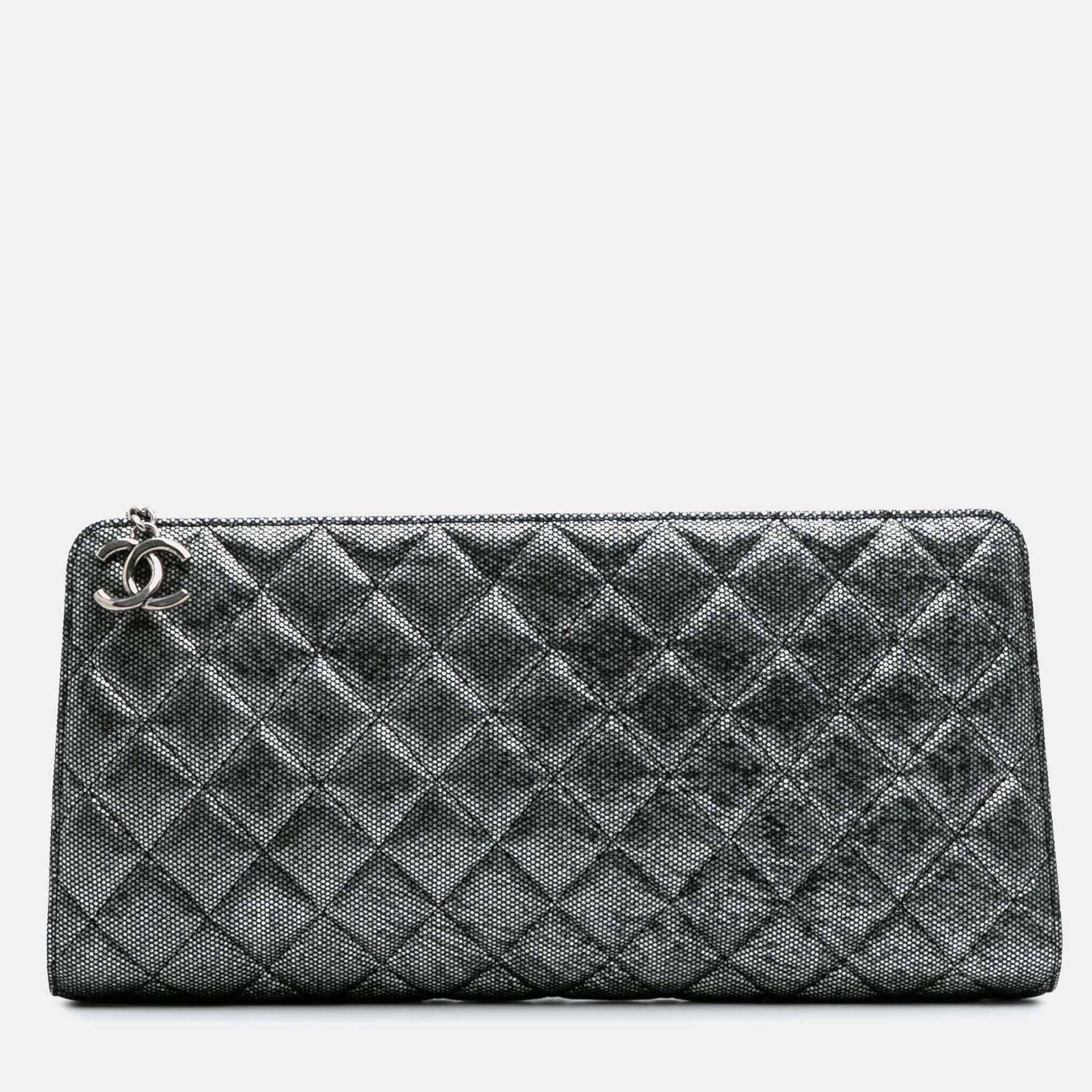 

Chanel Silver CC Quilted Metallic Calfskin Zip Clutch