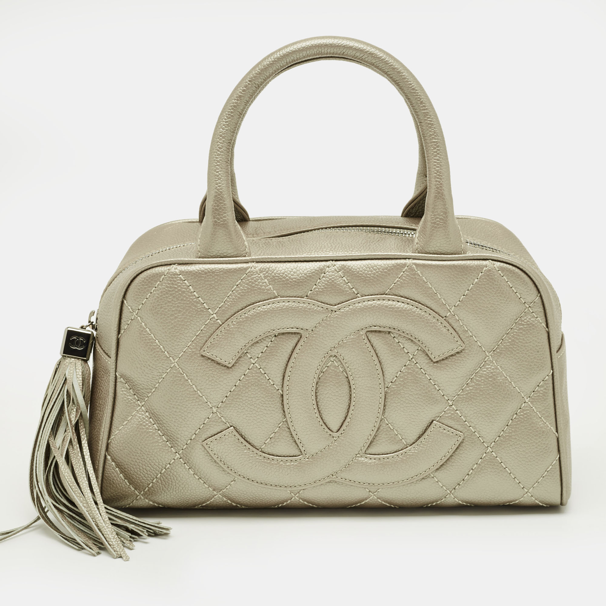 

Chanel Metallic Quilted Caviar Leather Small Tassel Bowler Bag